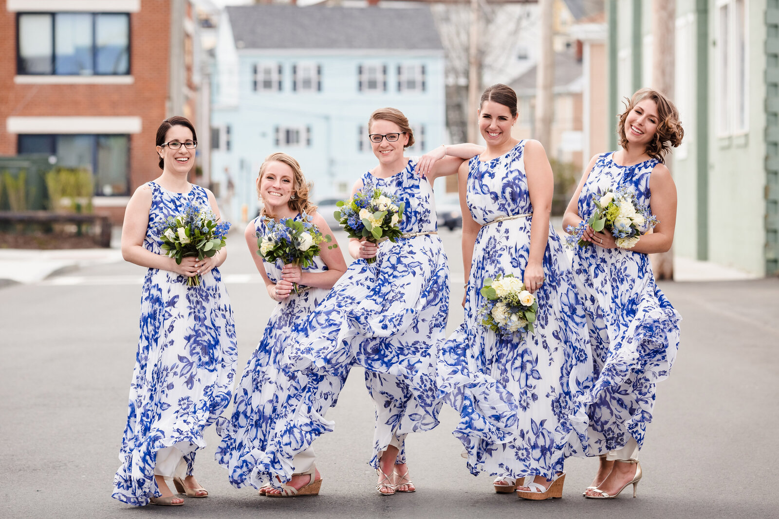 bridesmaids in colorful dresses laughing