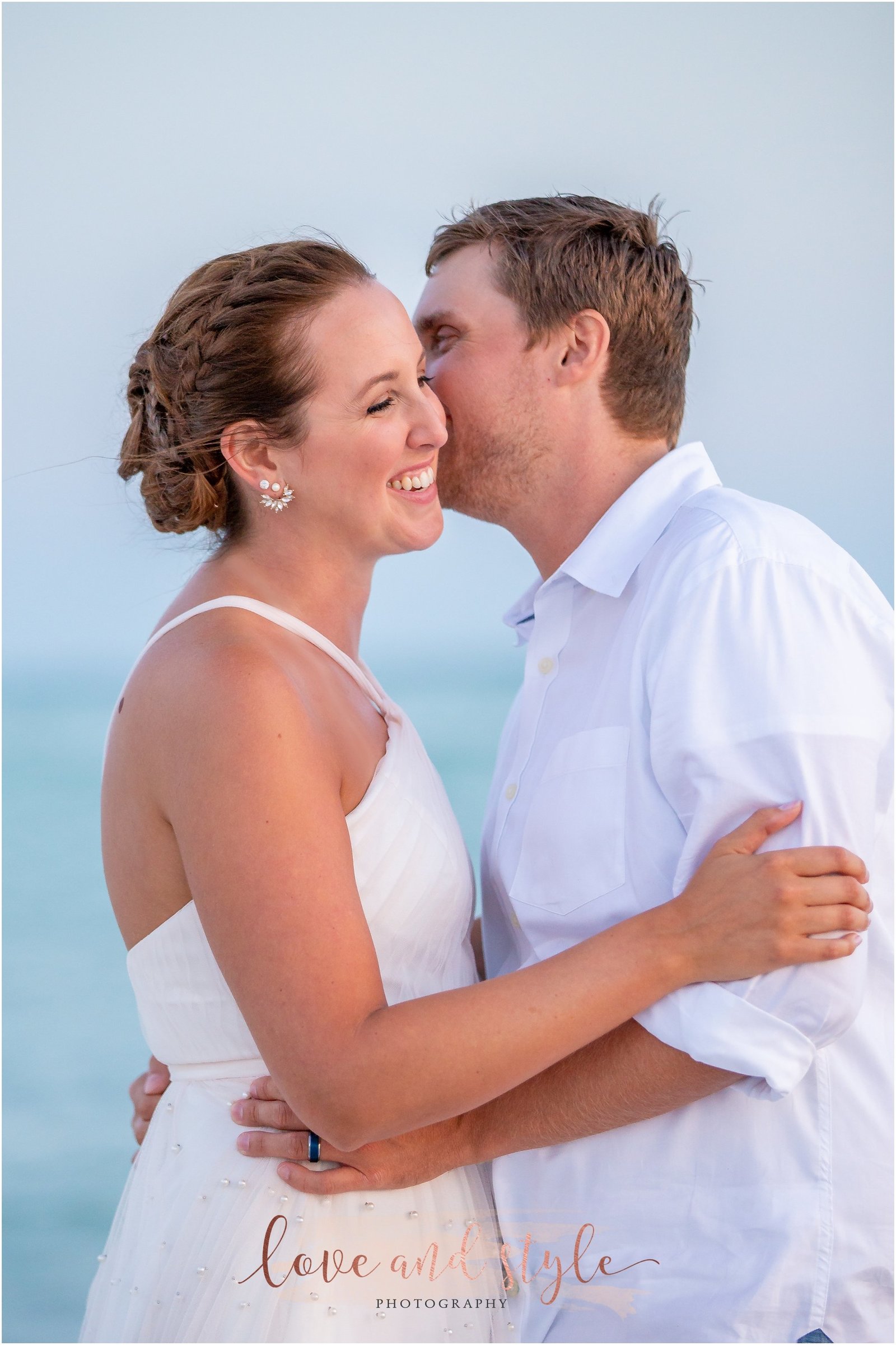 Lido Beach Wedding Photography of bride and groom laughing together on the beach