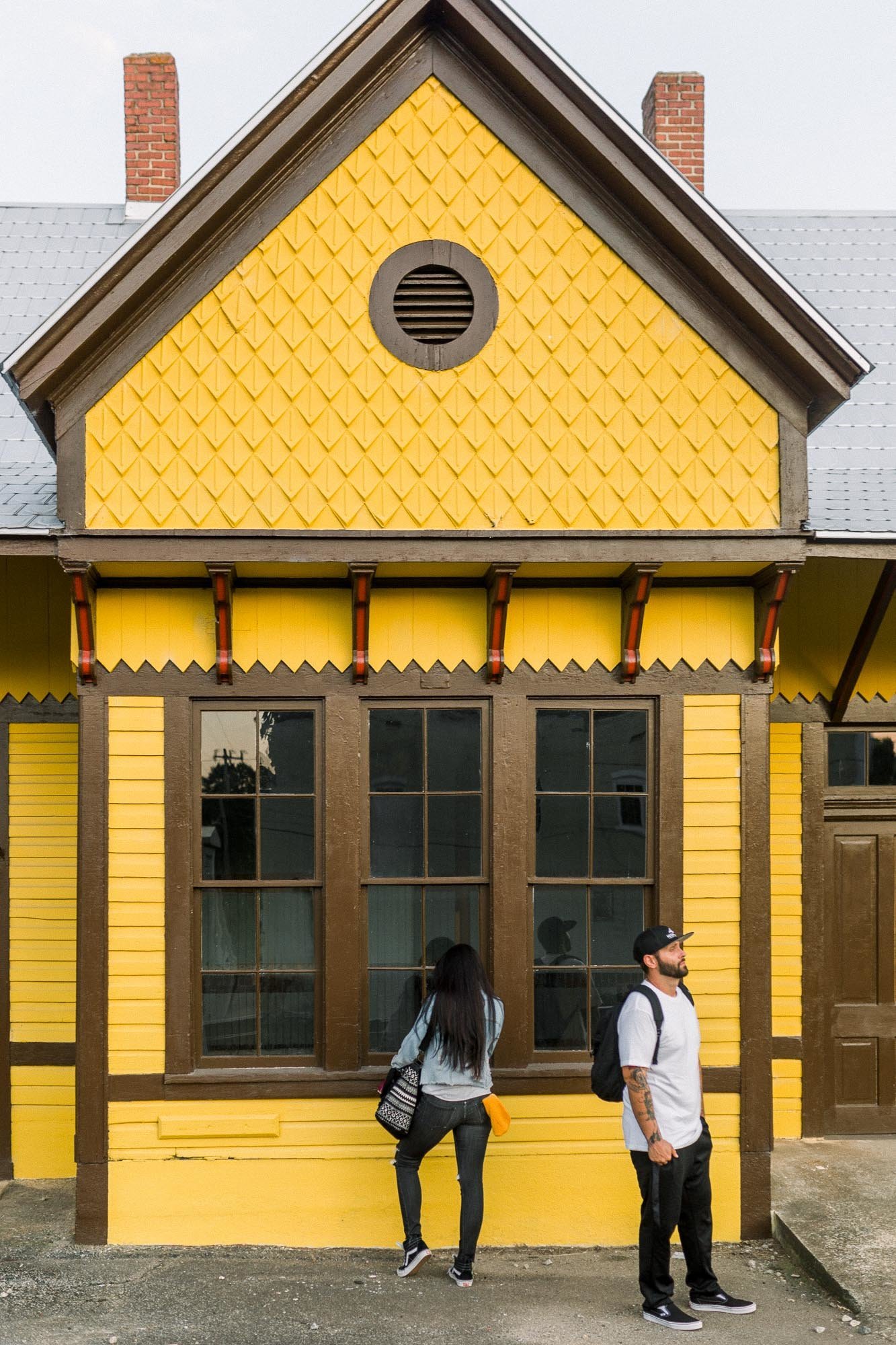 Engagement session in yellow train station captured by Staci Addison Photography