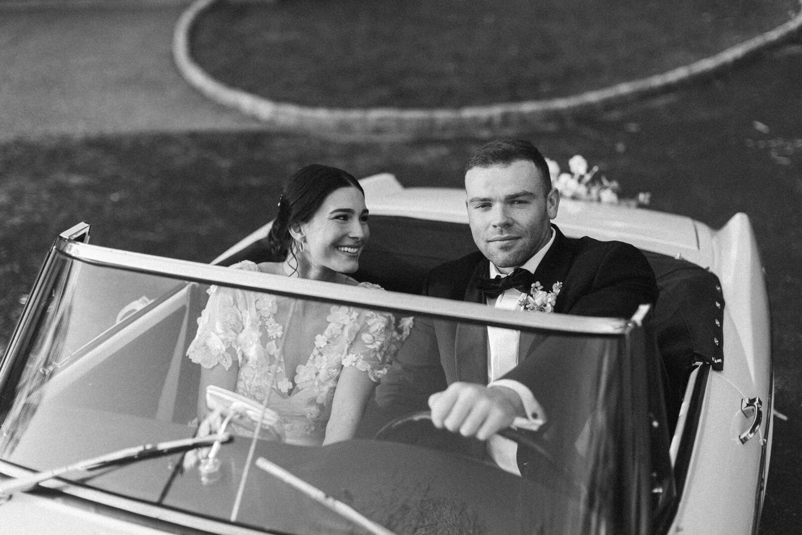 Couple leaving wedding in vintage car by wedding photographer in Philadelphia Samantha Jay