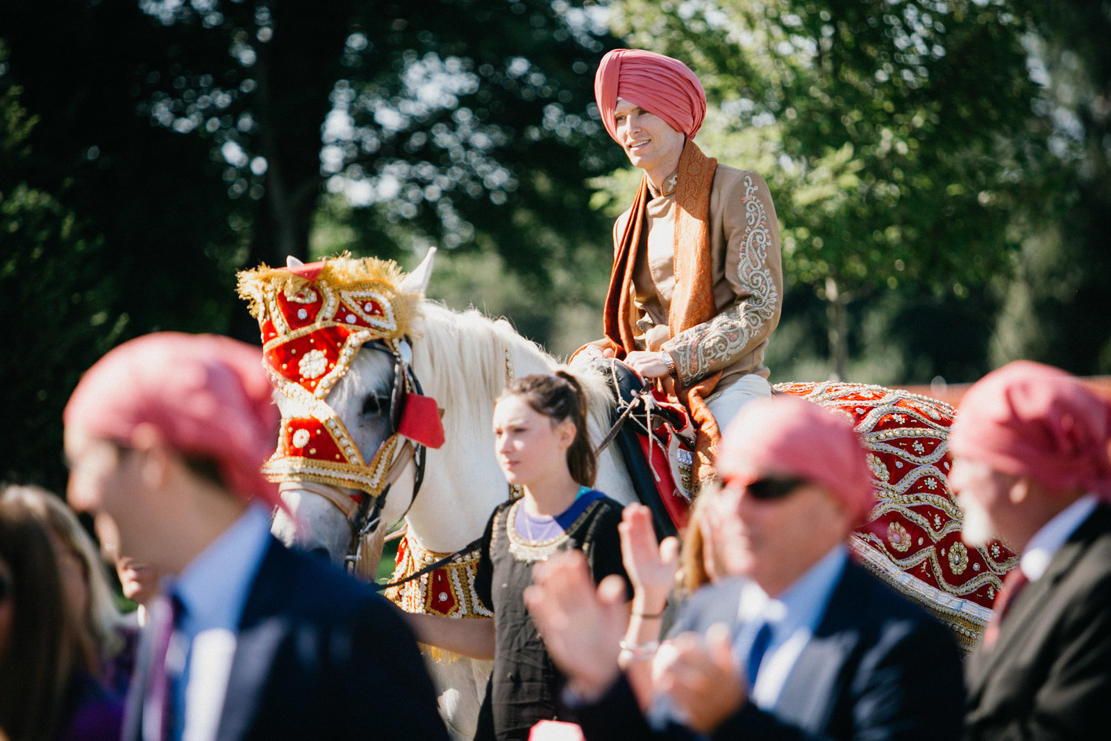 Groom photographed on a horse for the Indian part of the wedding ceremony during their two day wedding celebration.