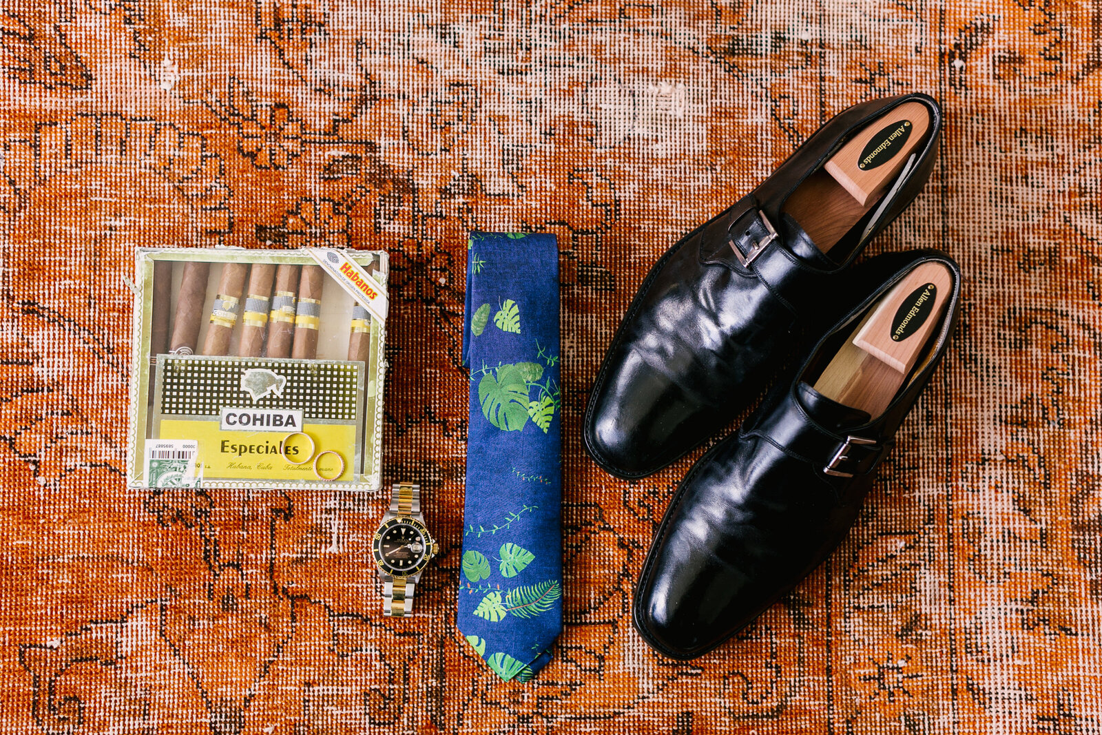 grooms details with tie and cigars