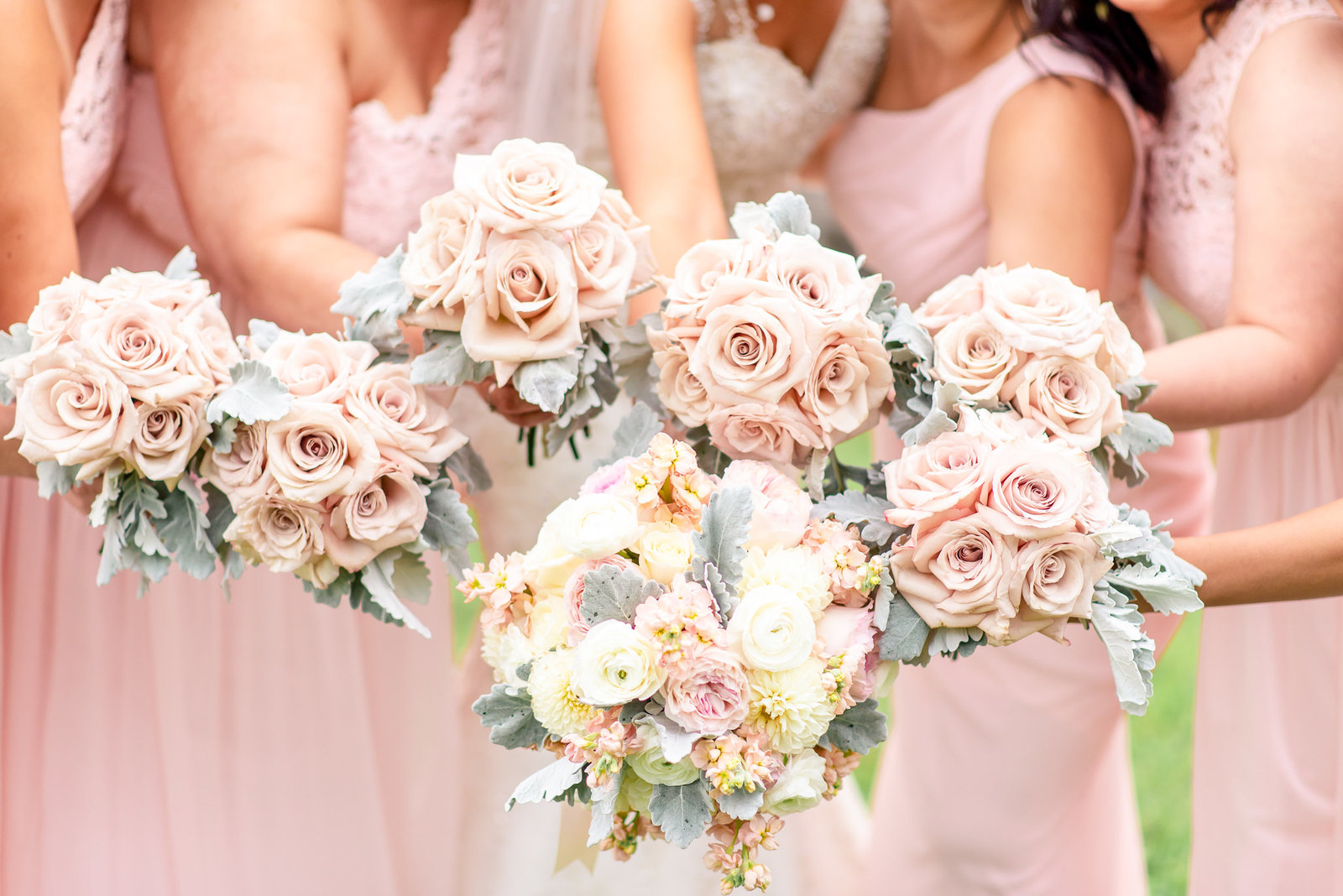 Pink, peach, and green wedding bouquets