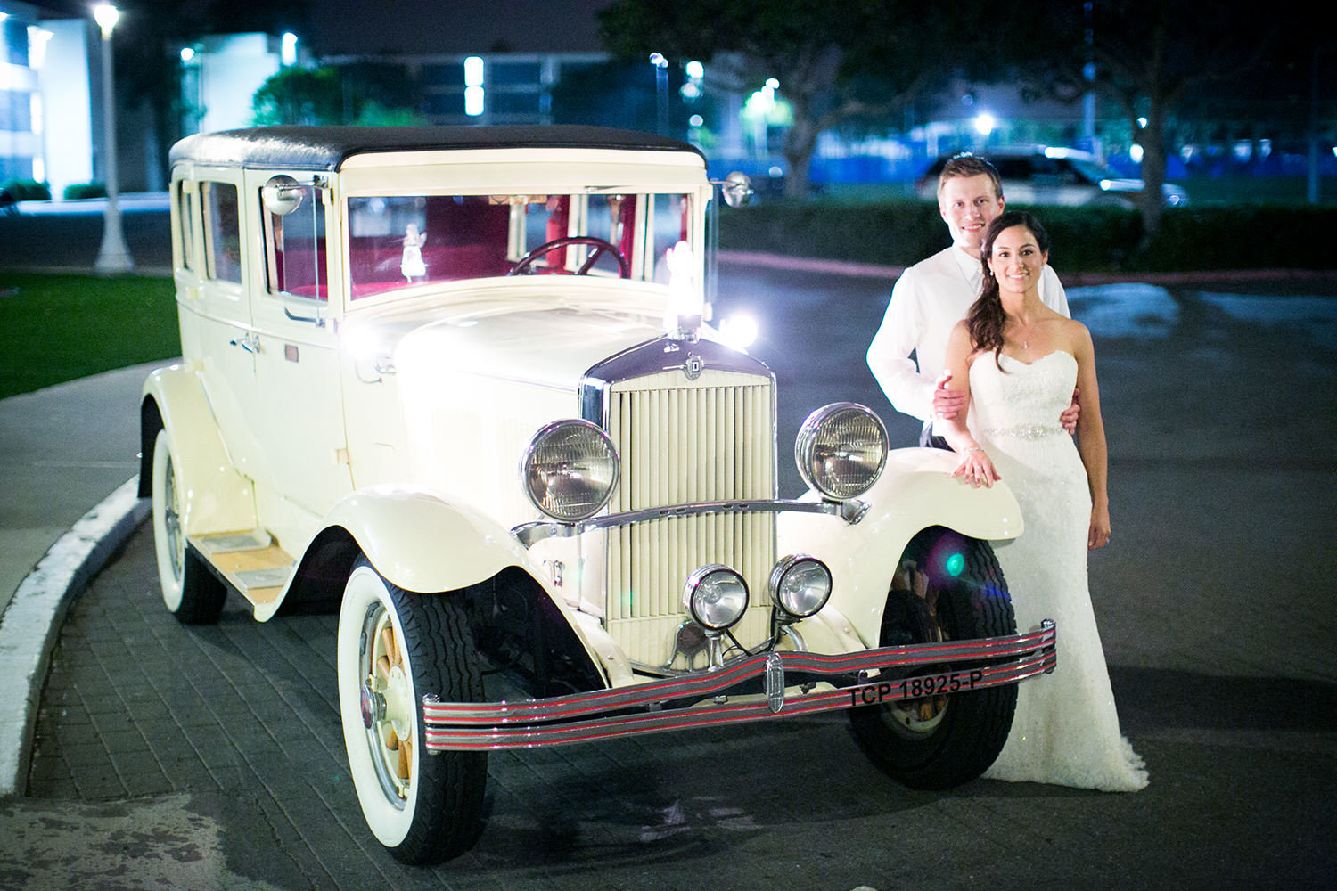 bride and groom with classic car night shot at admiral kidd club