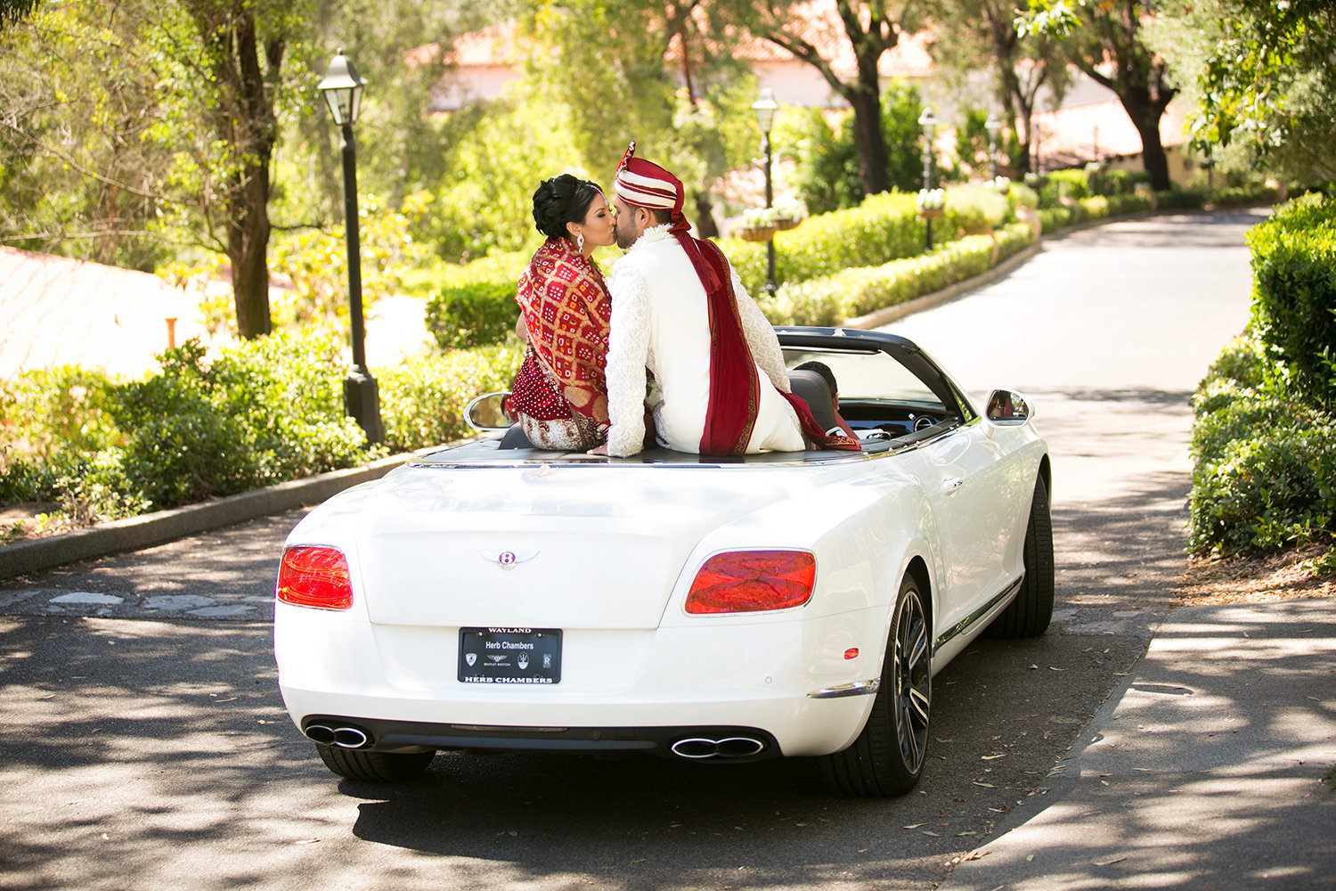 Indian bride and groom make their grand exit in a Bentley