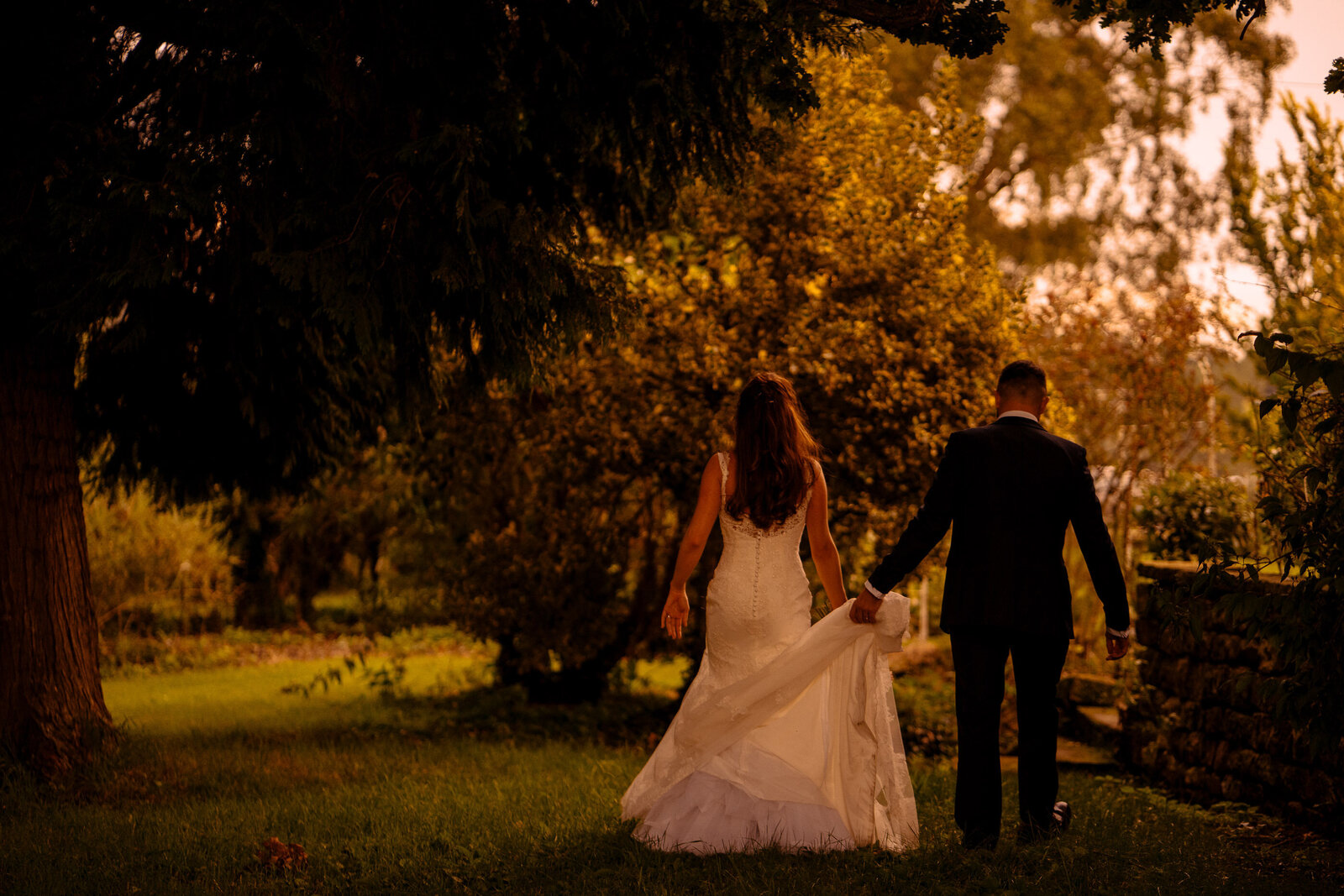 Bride and groom in the orchard at Wharfedale Grange Wedding venue