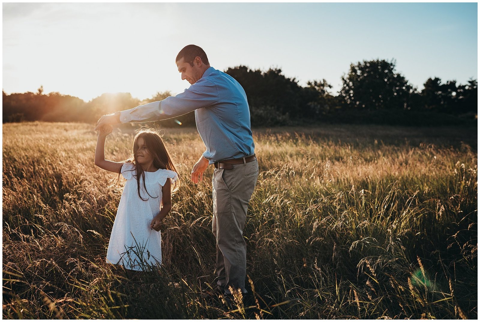 Dad dancing with daughter in field at sunset Emily Ann Photography Seattle Photographer