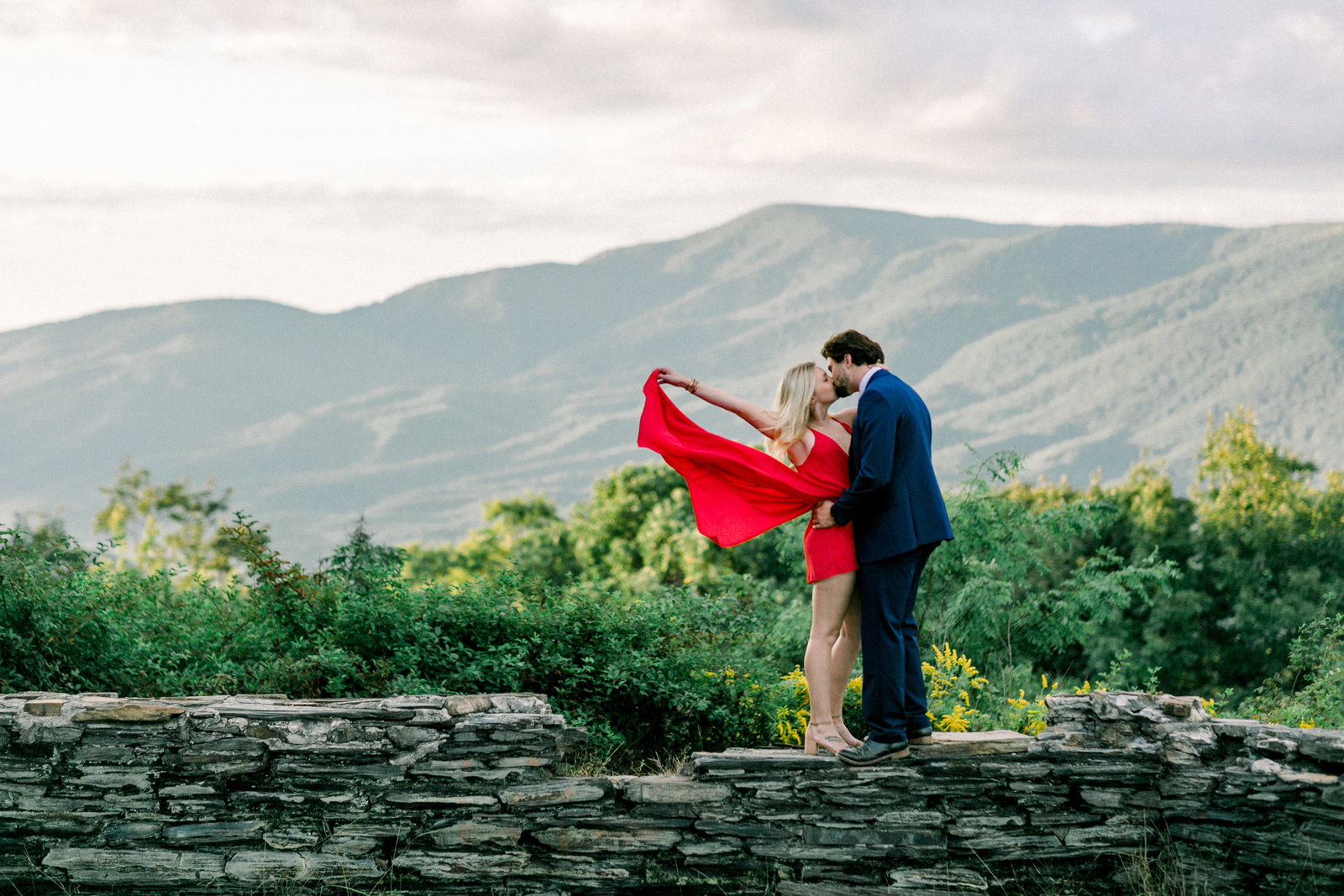 Newly engaged couple with a beautiful view captured by Staci Addison Photography