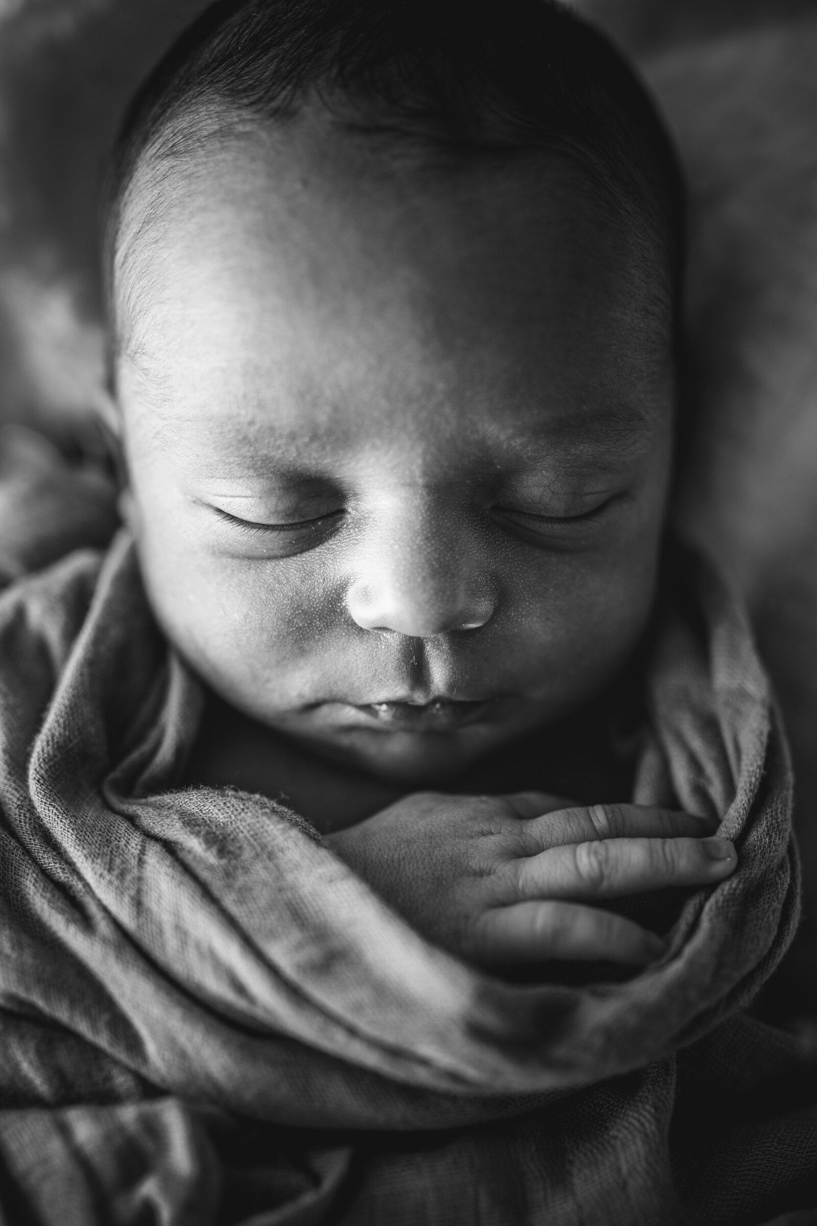 Newborn Photographer, black and white image of newborn baby sleeping
