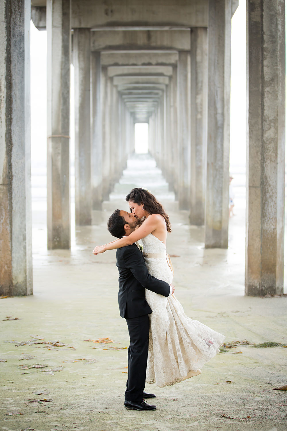 scripps pier with bride and groom