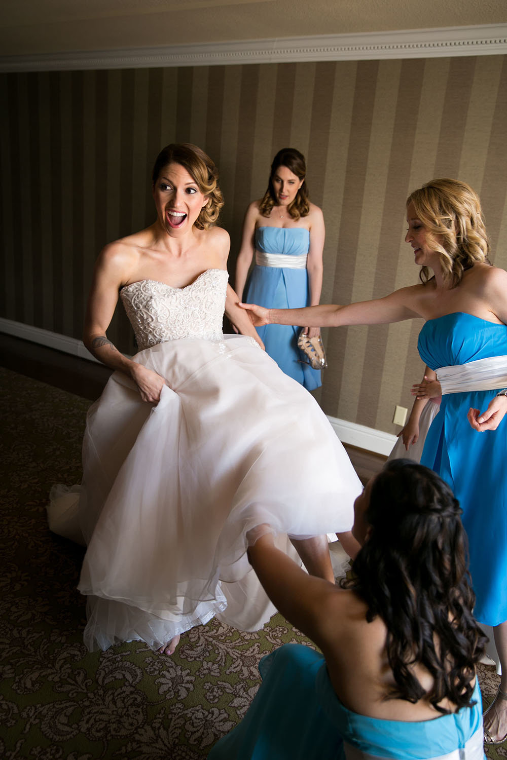 Bride and bridesmaids getting ready before the wedding ceremony