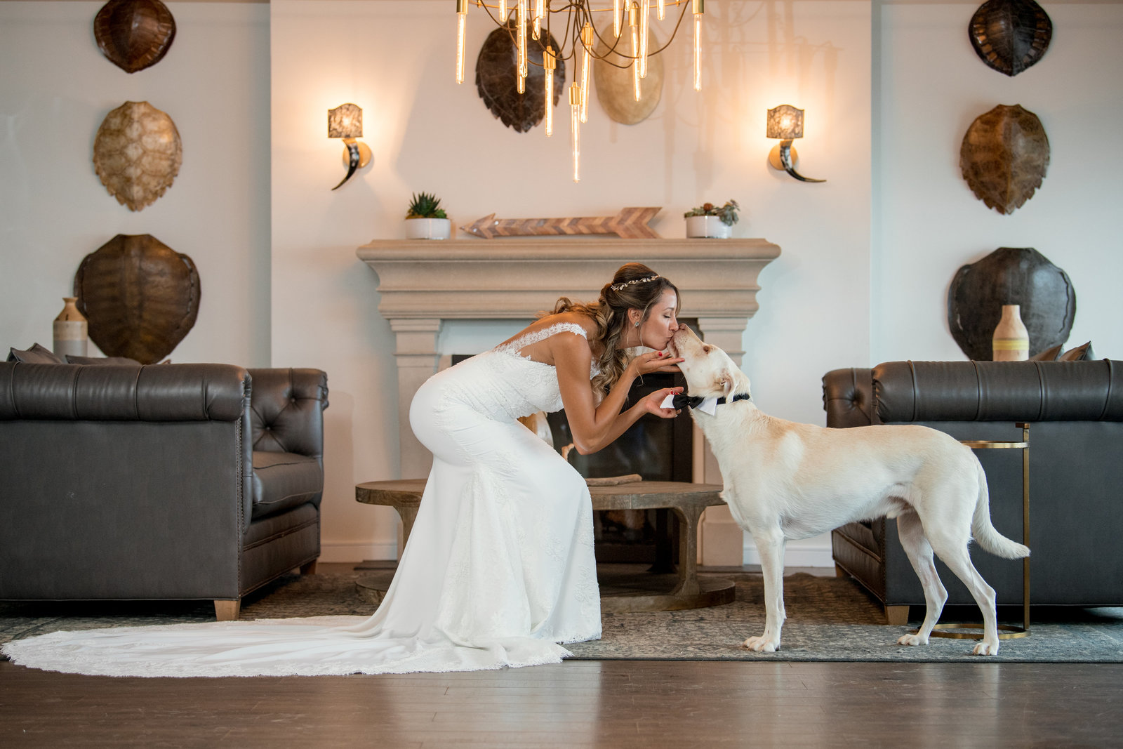 photo of bride kissing her dog inside the Gurneys Montauk Resort wedding