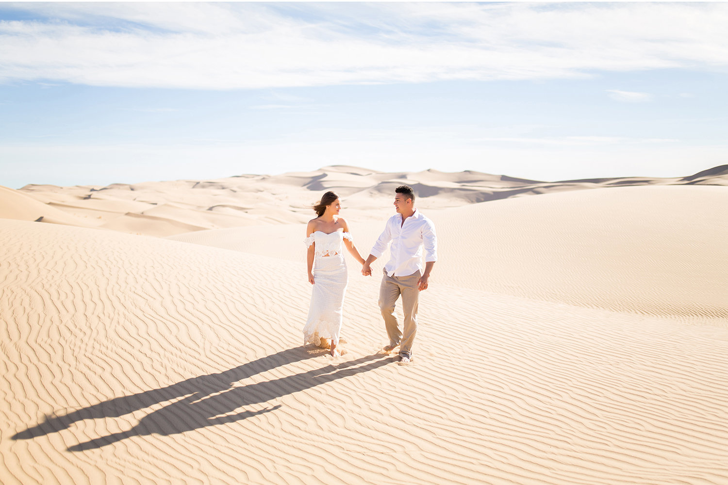 Bride and Groom Walking in the Desert Sand Dune Wedding Photo in Glamis