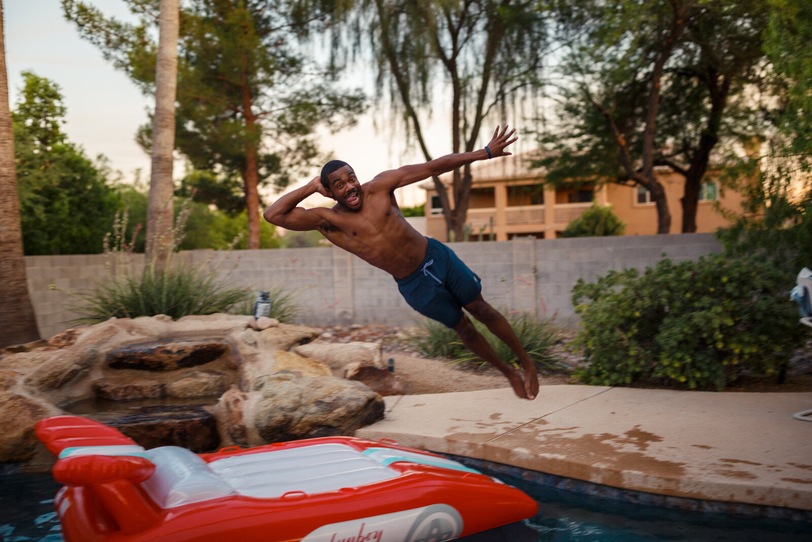 jumping onto floaty in pool