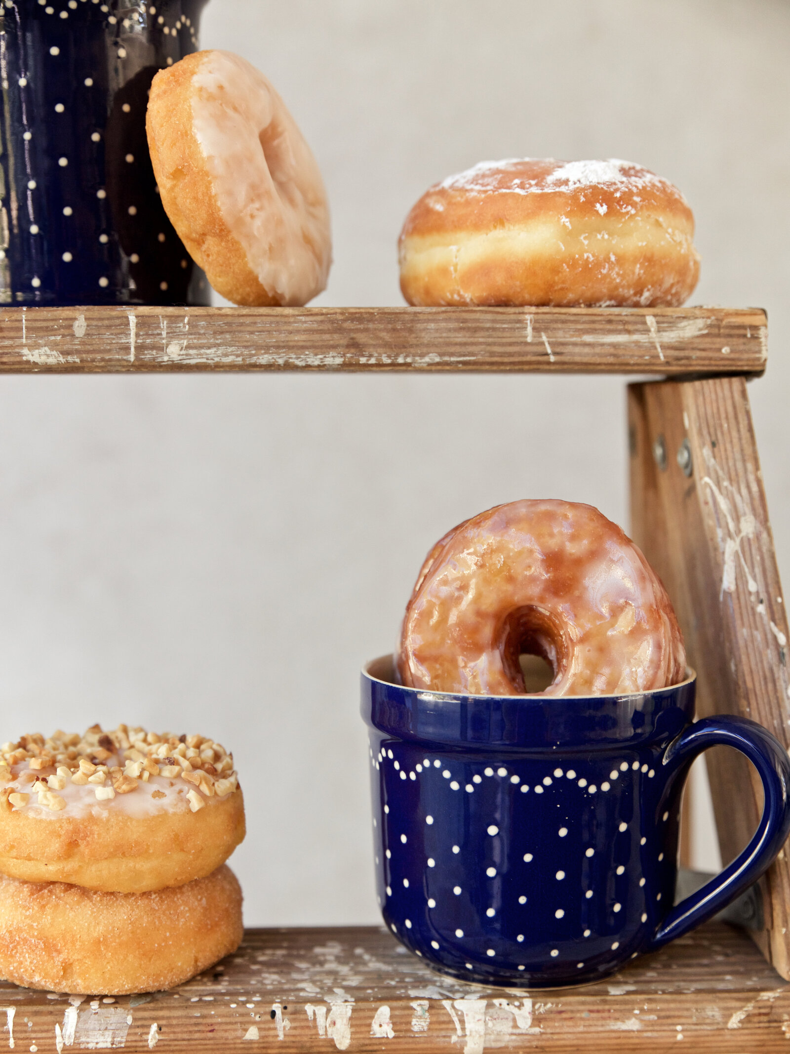 Rustic coffee mug with donuts for styled food photography in Southern California, San Diego donut pastry shop