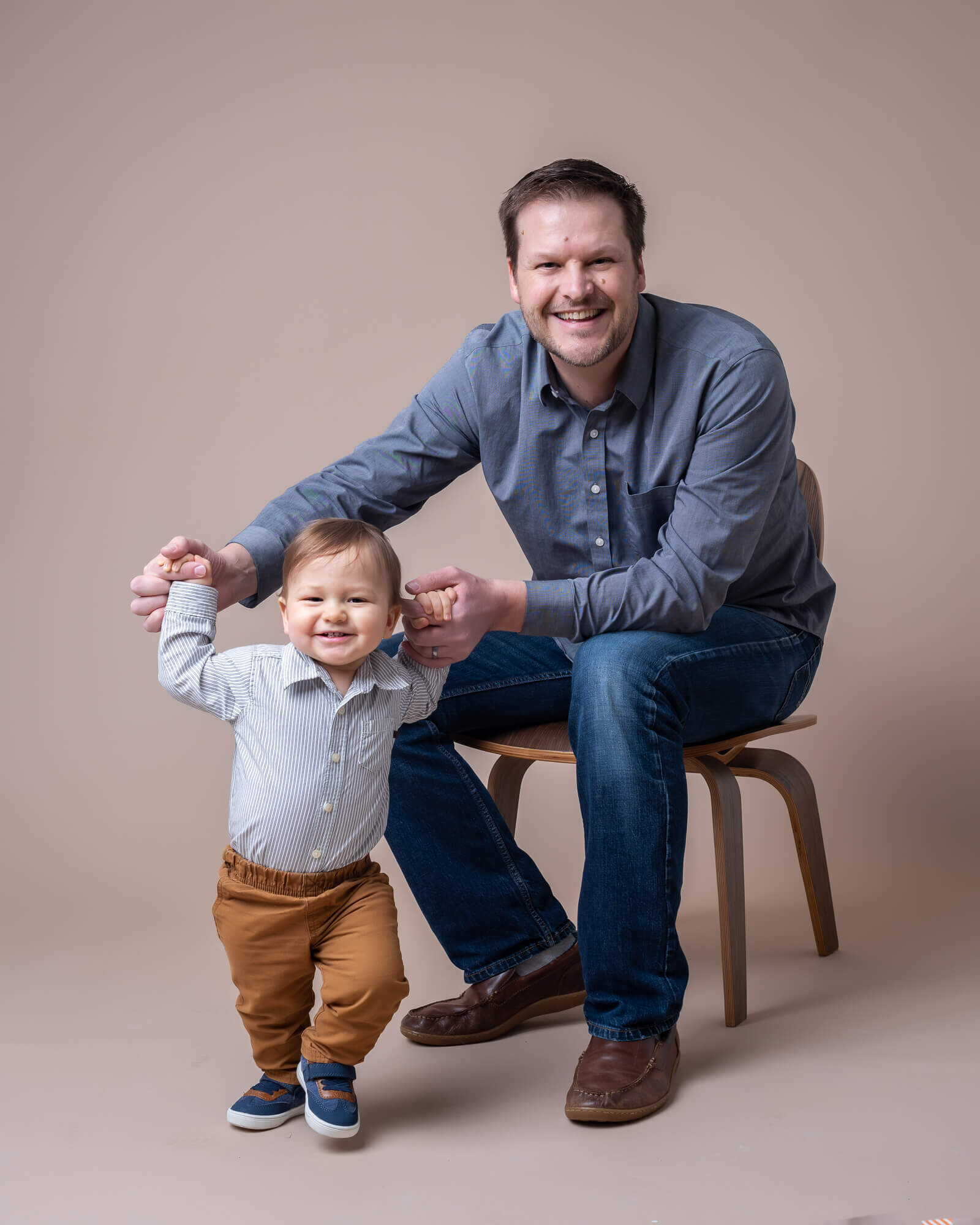 Modern studio pictures of father and toddler son