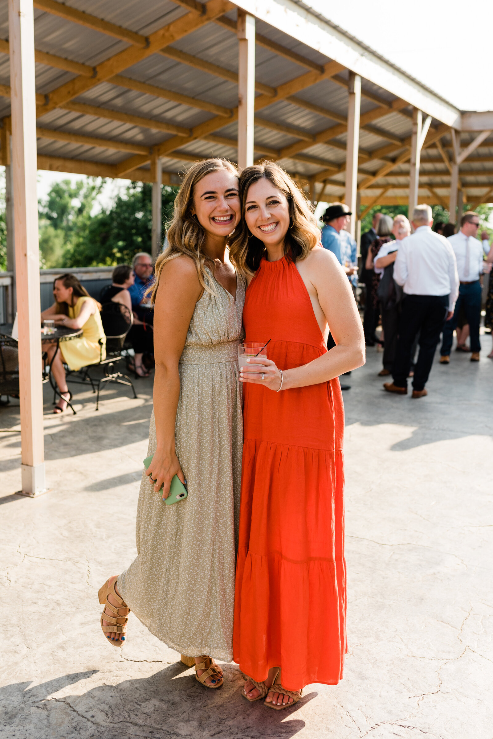 Wedding guests smiling at the Red Barn Farm