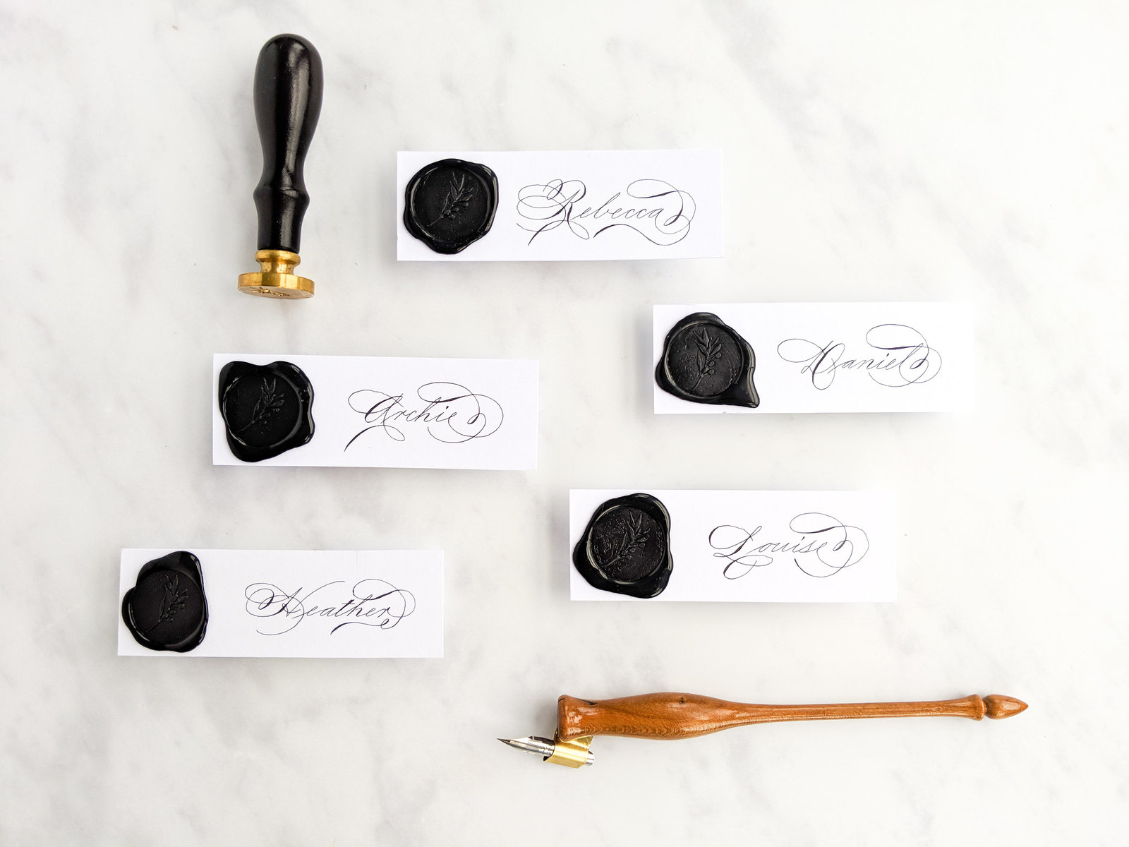 Black wax seal place cards with calligraphy for wedding