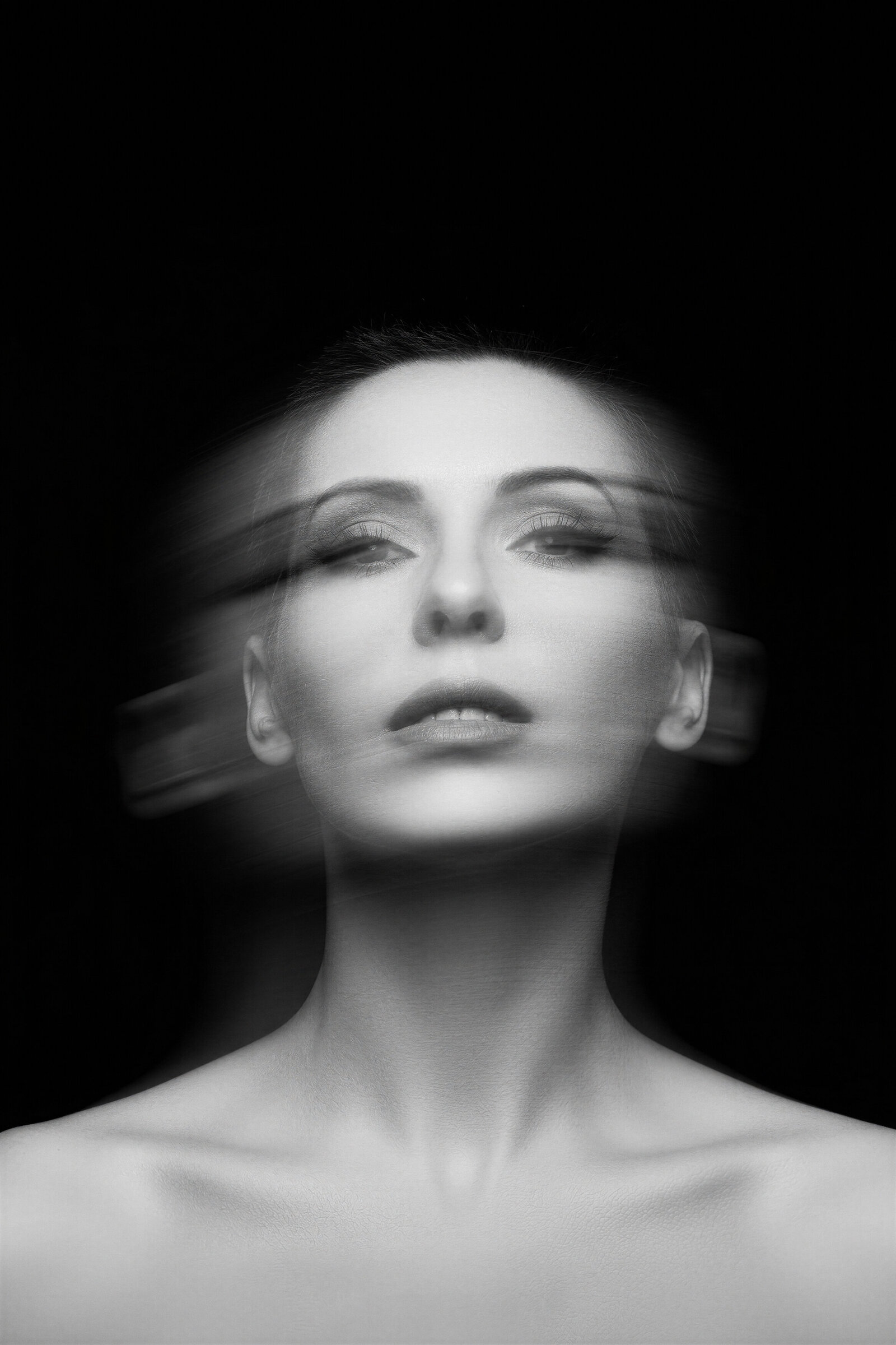 Close-up black-and-white portrait of Jasmina Kimova with dramatic lighting and microphone shadow, featured in podcast strategy section.