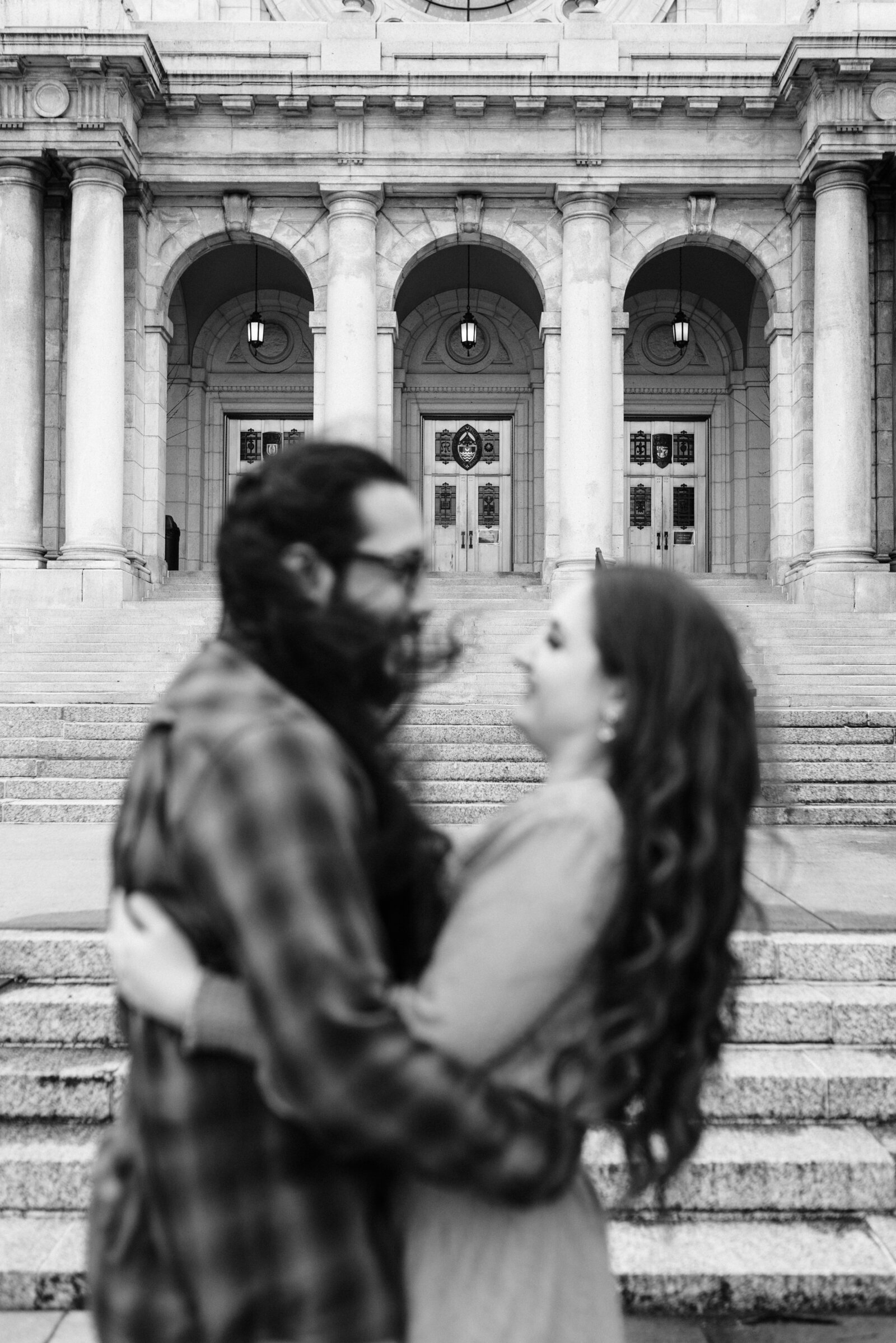 Couple looking at each other in front of the Basilica of Saint Mary