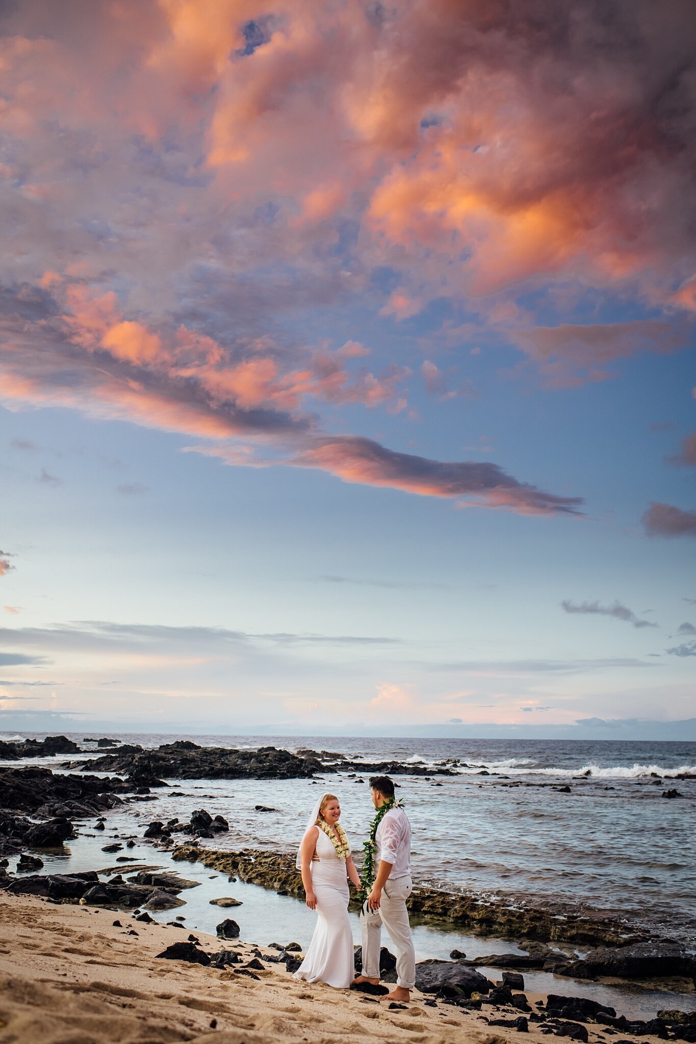 colorful sunset during their big island elopement