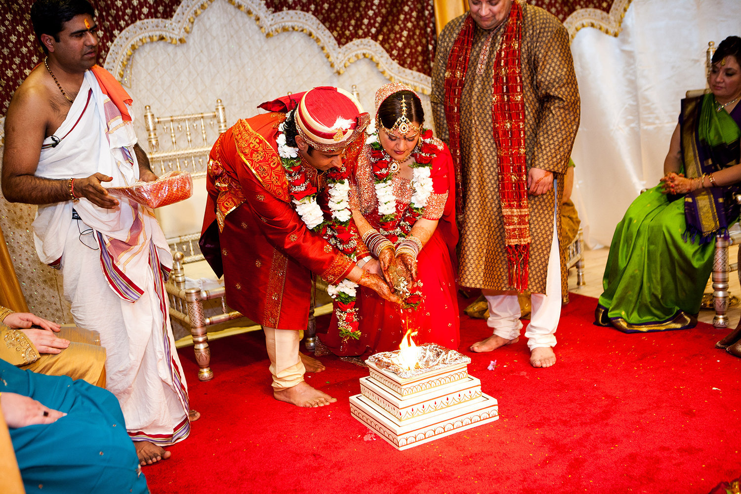 Indian bride and groom participate in mangal pherā during their Hindu wedding ceremony