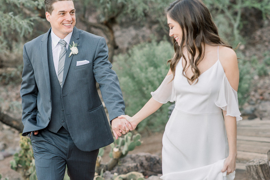 Romantic Gather Estate Wedding Photo of Bride and Groom Holding Hands | Tucson Wedding Photographer | West End Photography