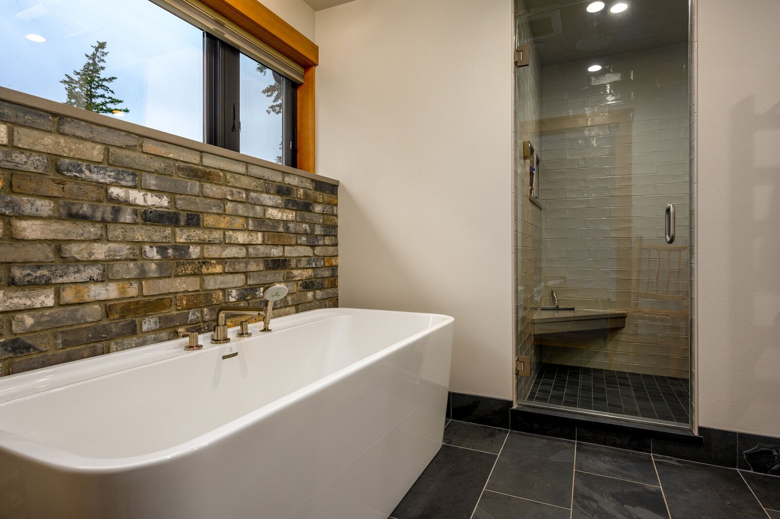 modern and stone bathroom with large bathtub