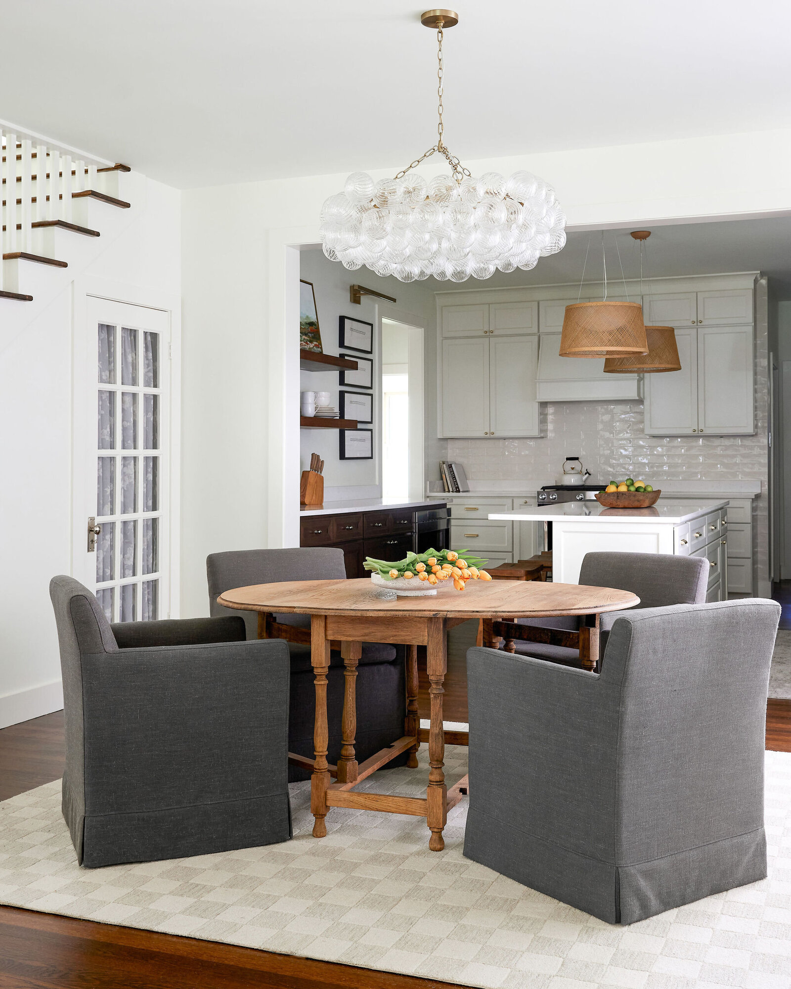 cocoloba homes cockrell ave dining room with gray chairs and wooden round table