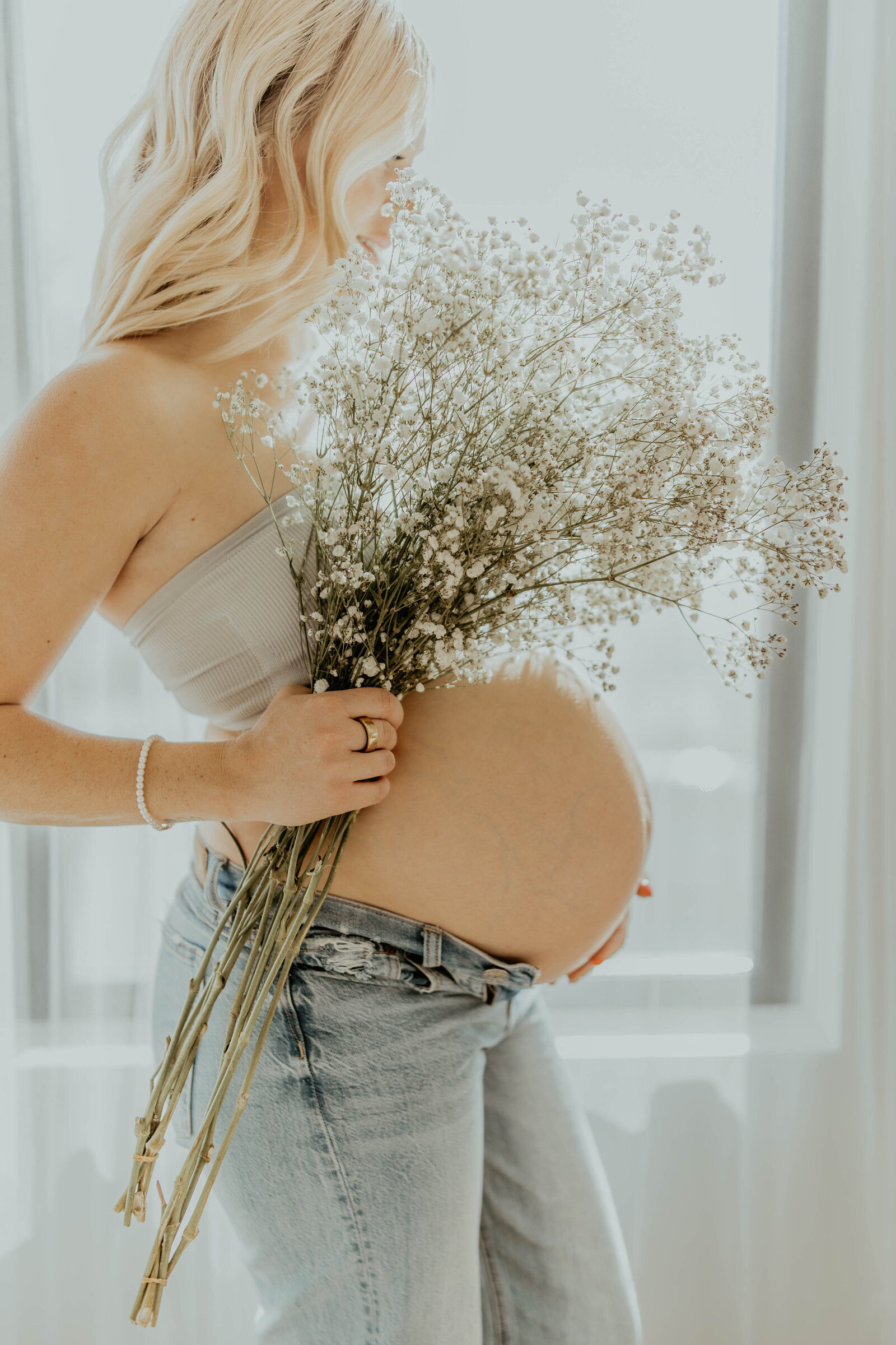 Artistic motherhood portrait with dried bouquet