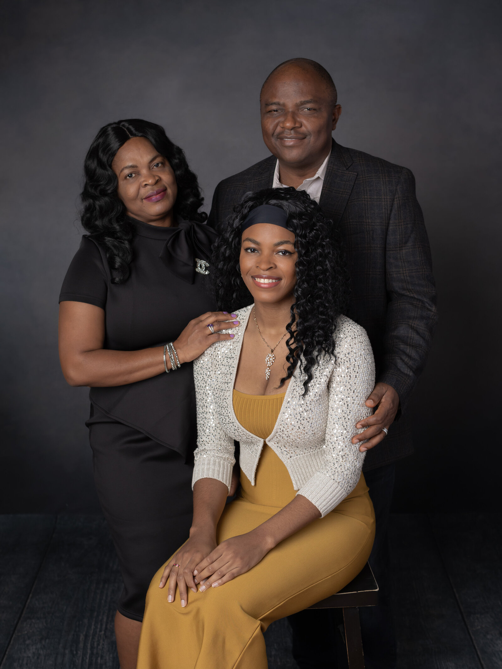 parents and daughter posed for studio family portraits cleveland family photography