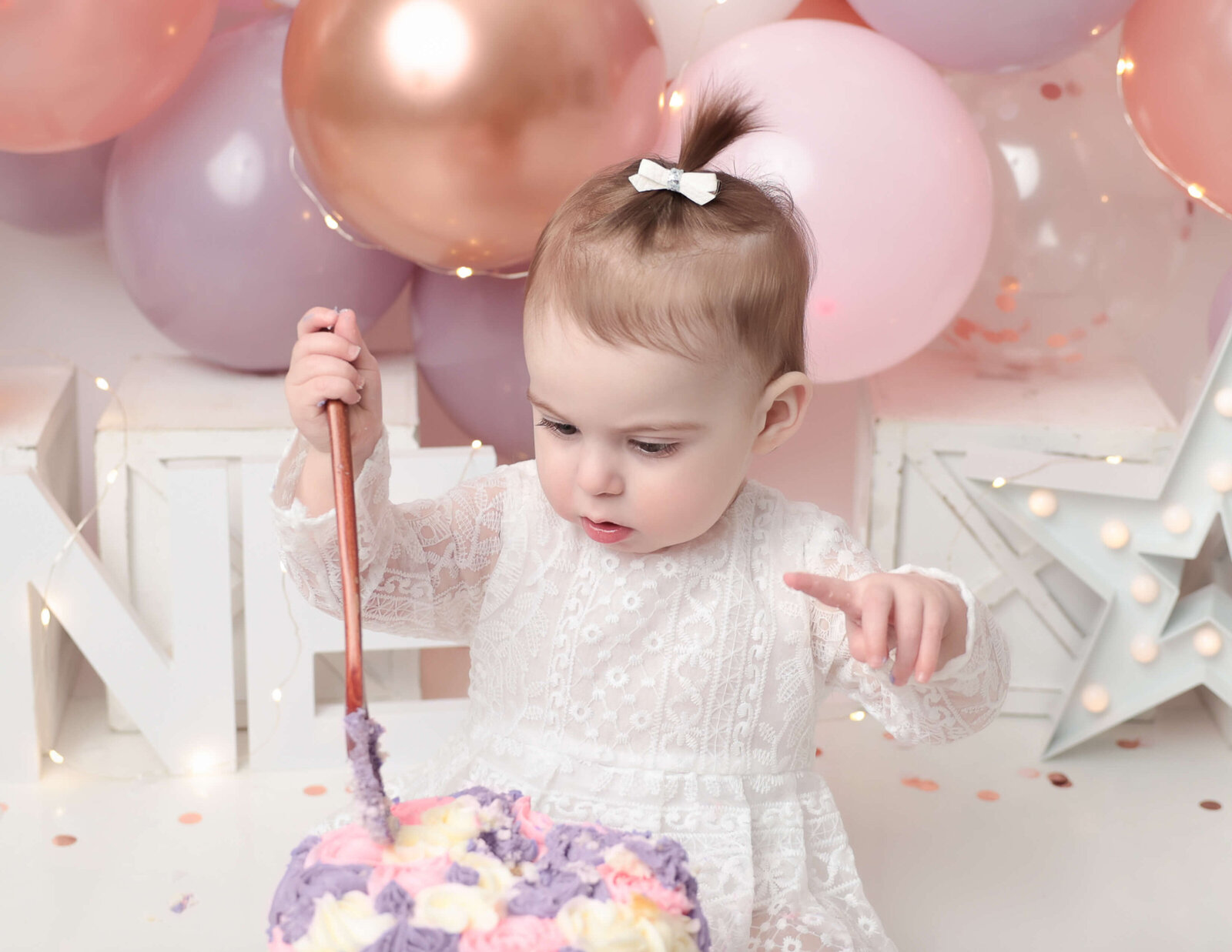 Girly cake smash at our in-home Rochester, NY studio.