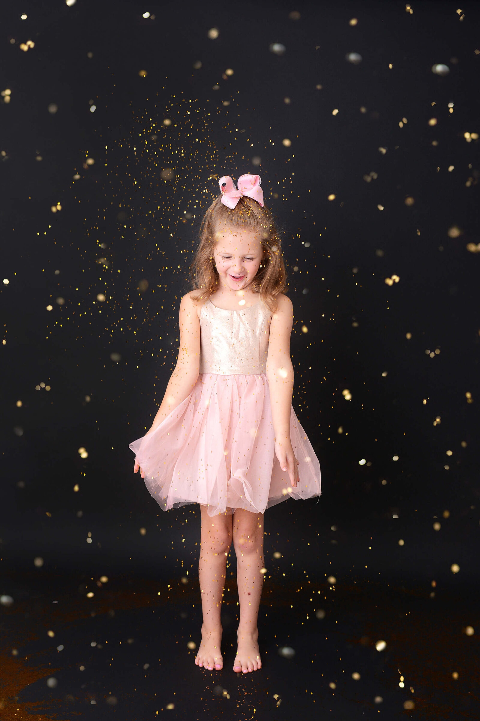 girl smiles at her glitter mini shoot in houston
