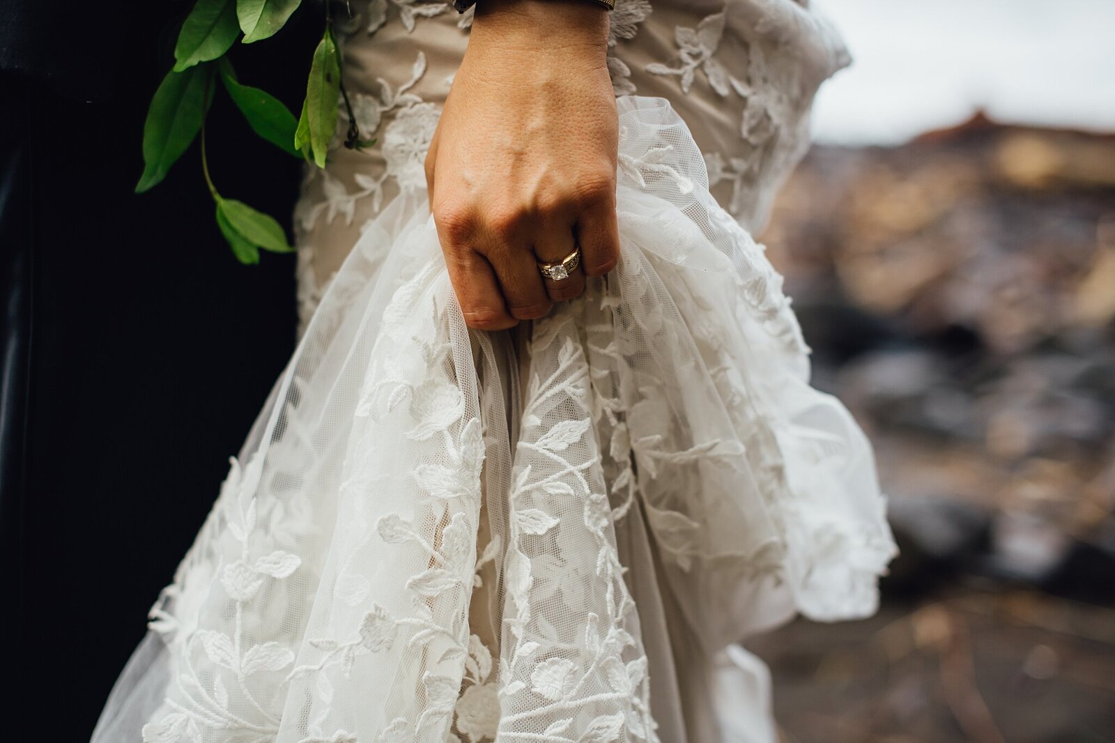 bride grabbing her wedding dress