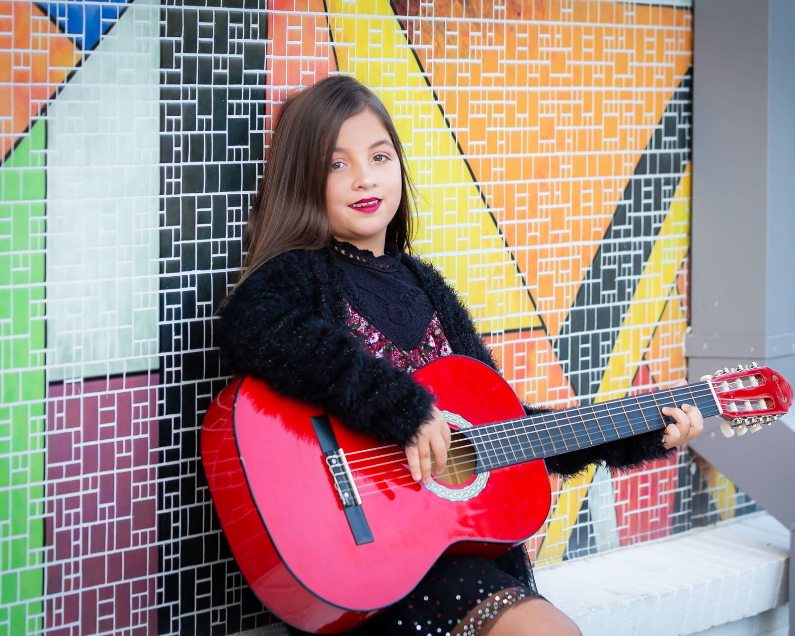 Musician headshot session in Orlando, Florida, featuring an artist holding a guitar.