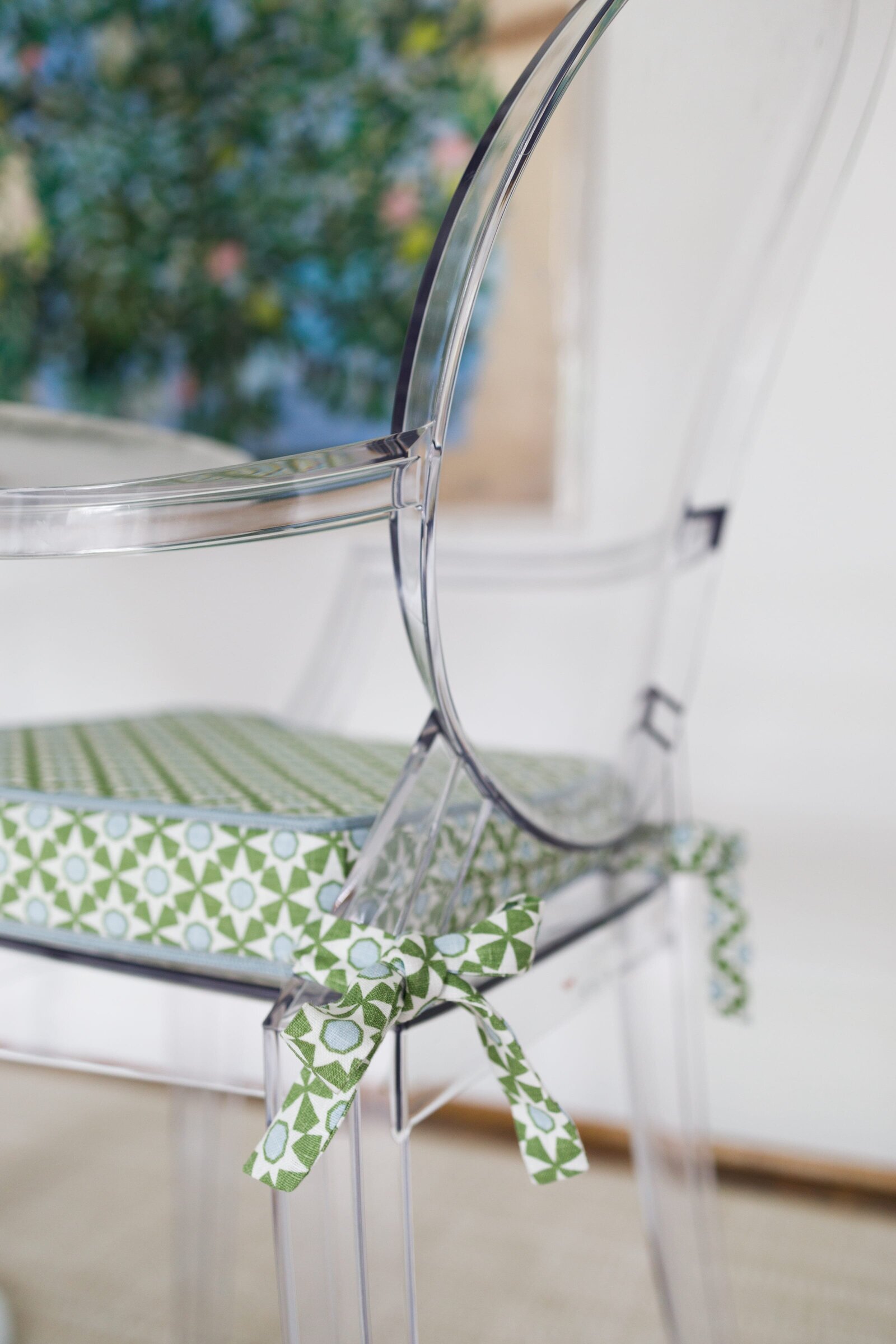 vision and hammer clear chair with green cushion