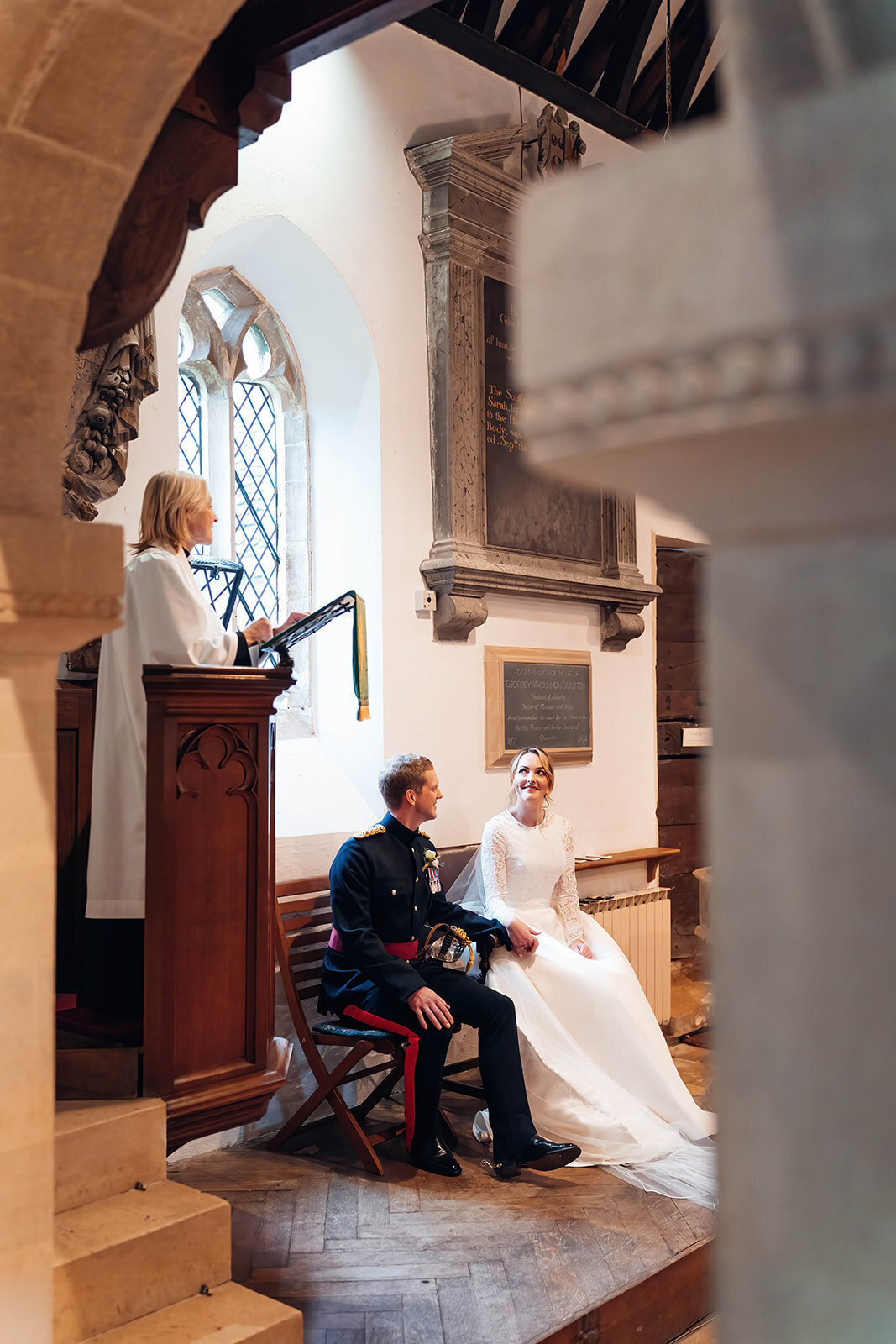 couple-enjoying-reading-during-cotswold-church-wedding