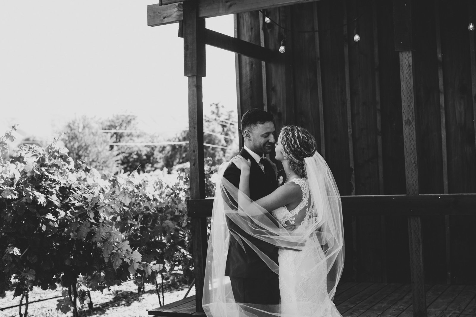 Bride and Groom at Terra Blanca Winery under archway