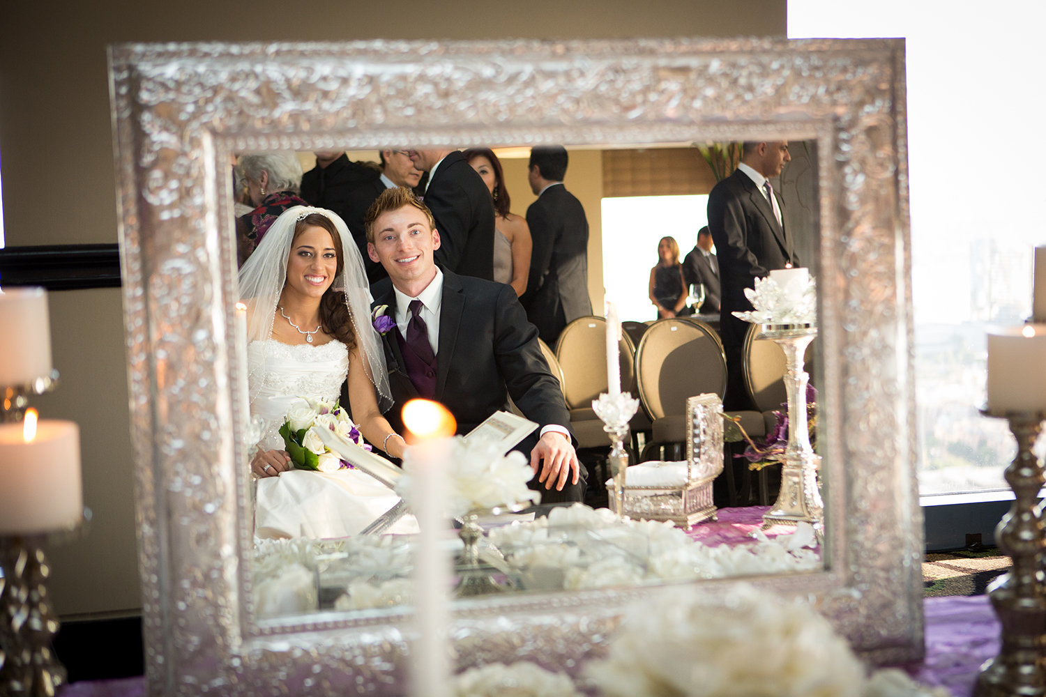 Portrait of bride and groom at persian wedding through mirror