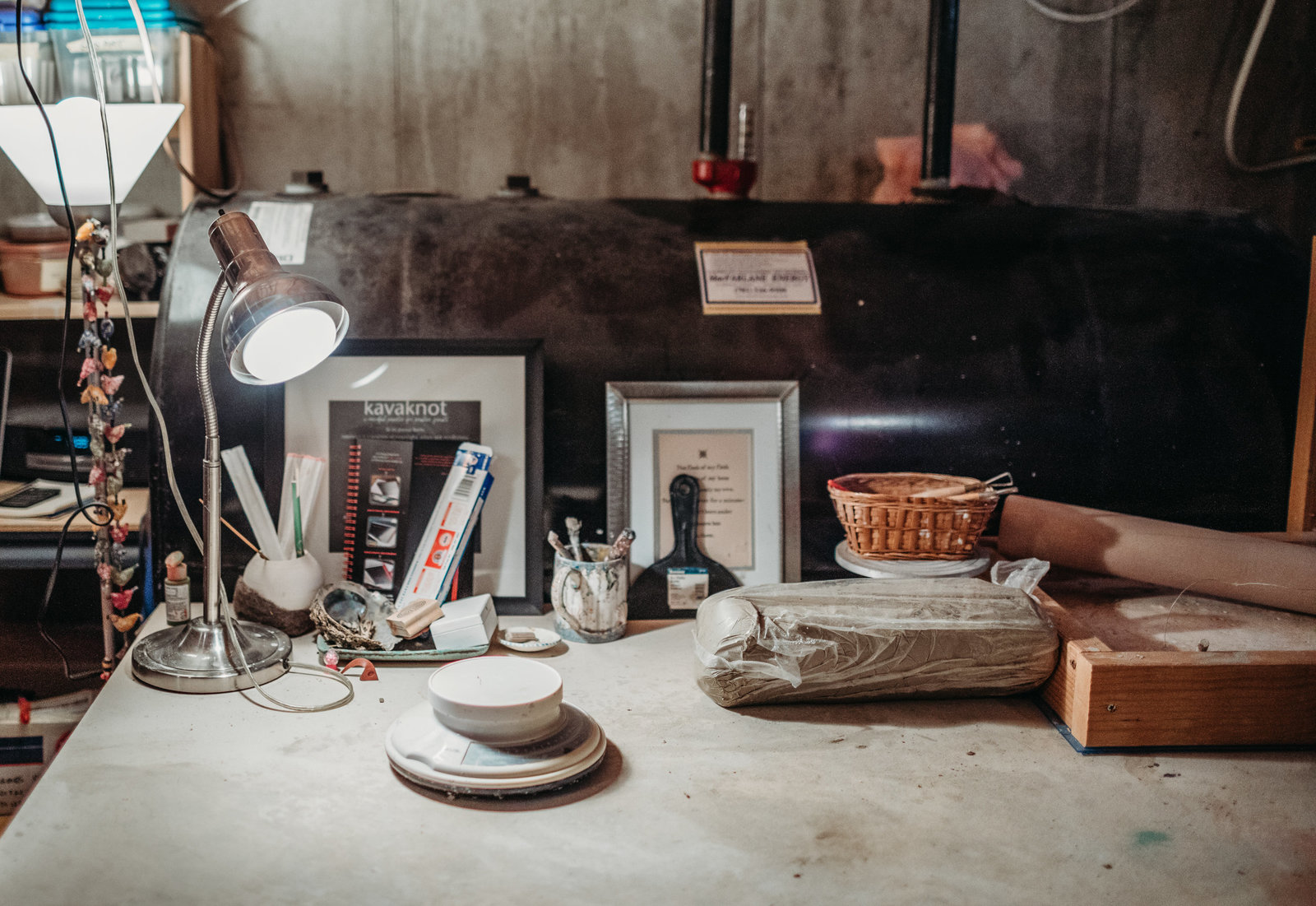 a potters work station in low light
