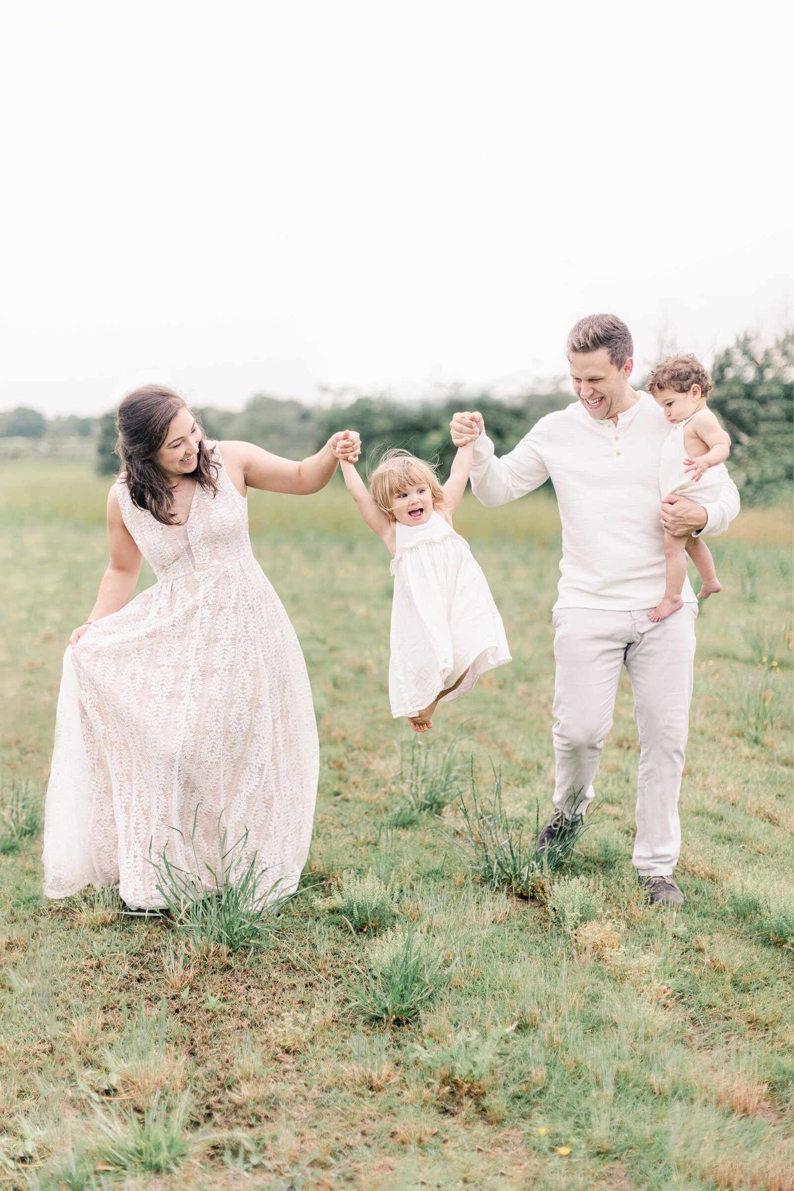 Family photo session with one year old and toddler girl.