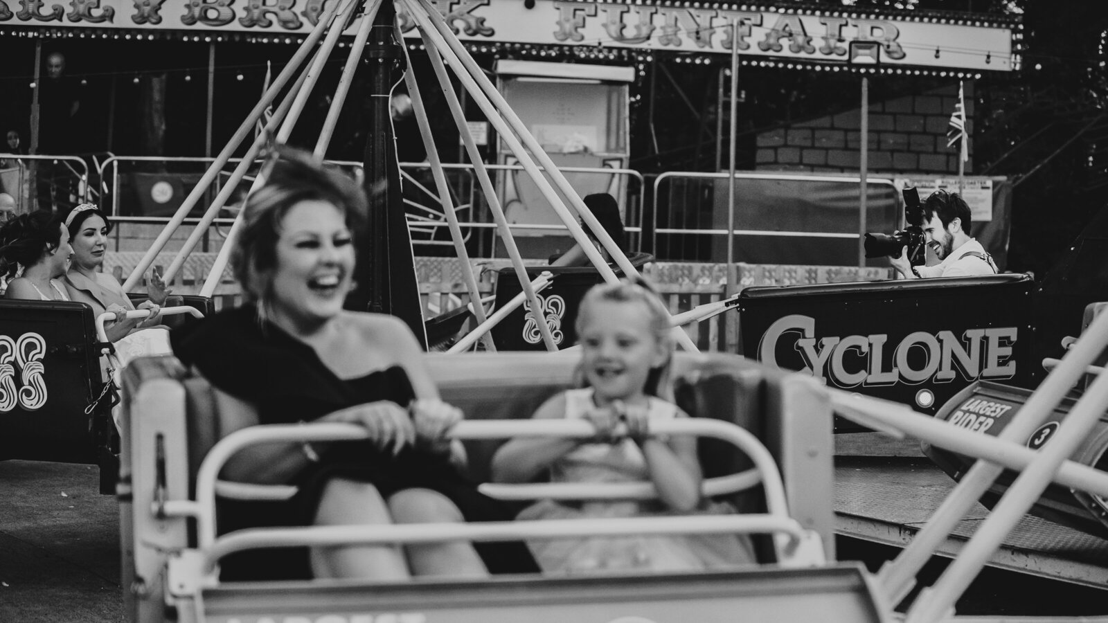 Tom Keenan the photographer on a fairground ride at Marleybrook House whilst taking photographs in black and white