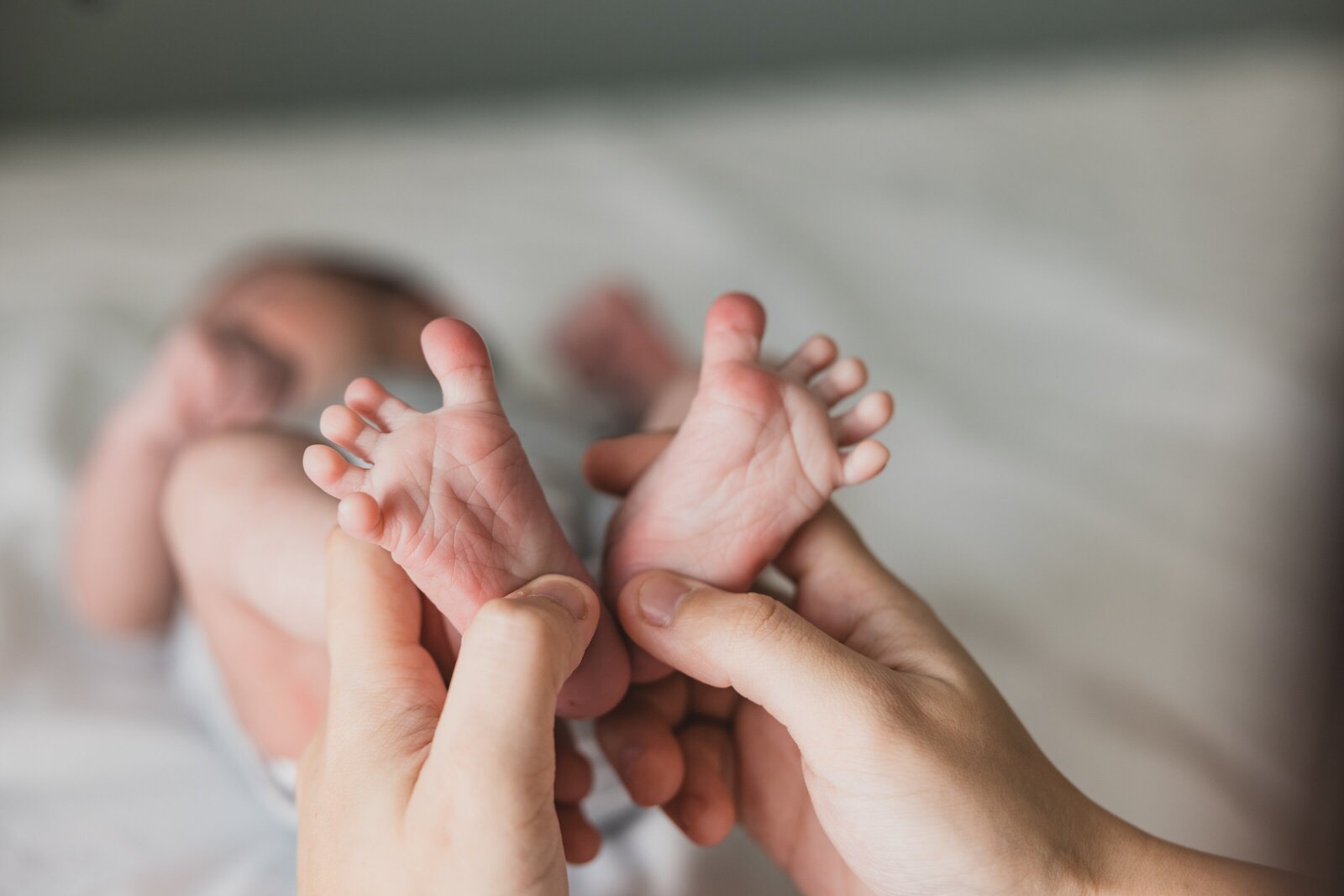 Sweet baby toes pose during lifestyle newborn photography session