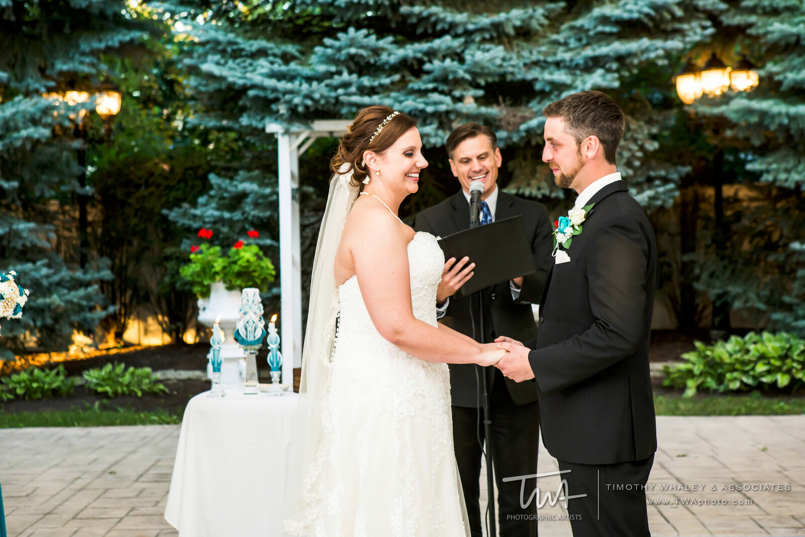Bride smiles while taking her wedding vows