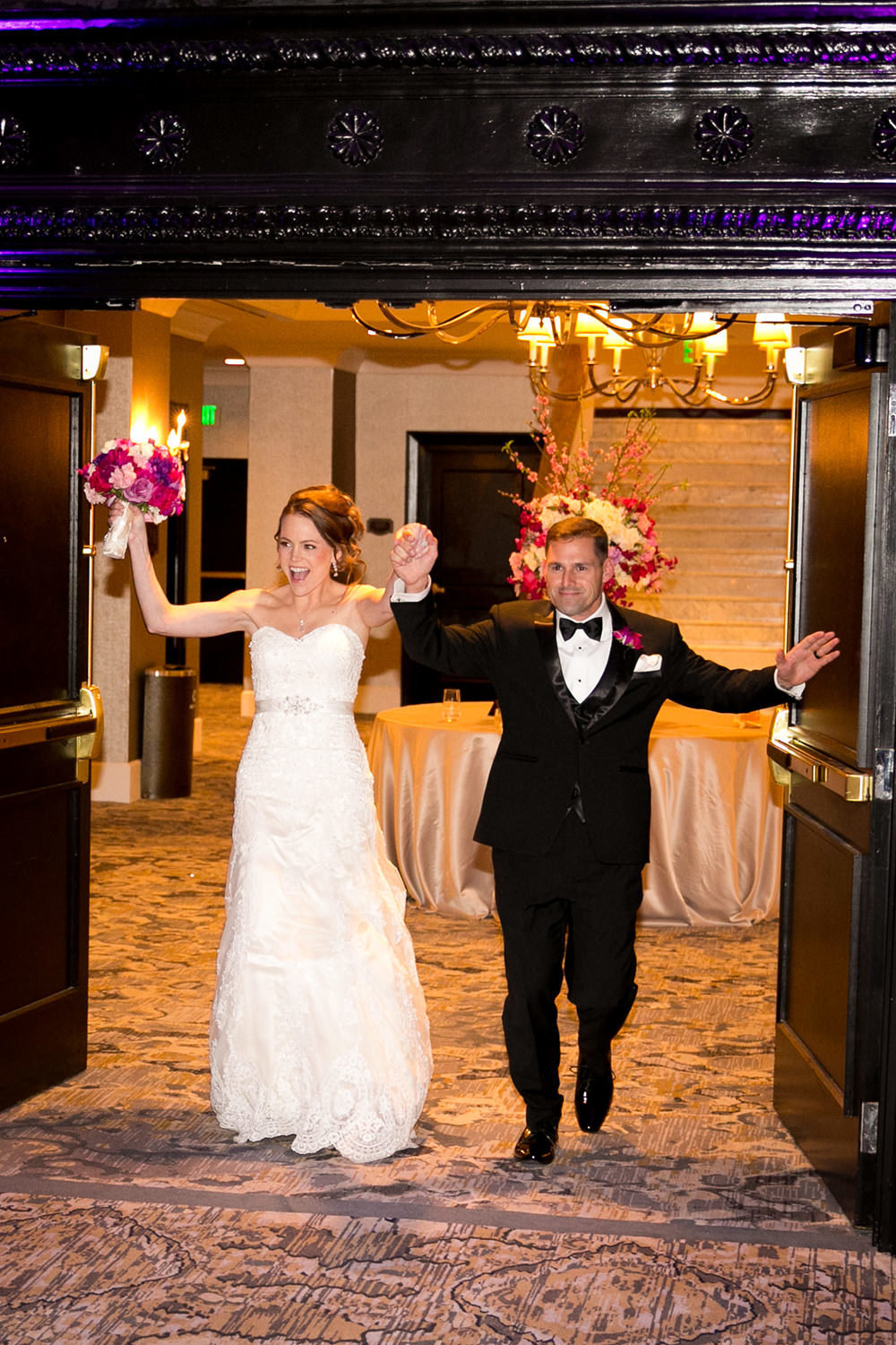 bride and groom walking into reception at us grant hotel