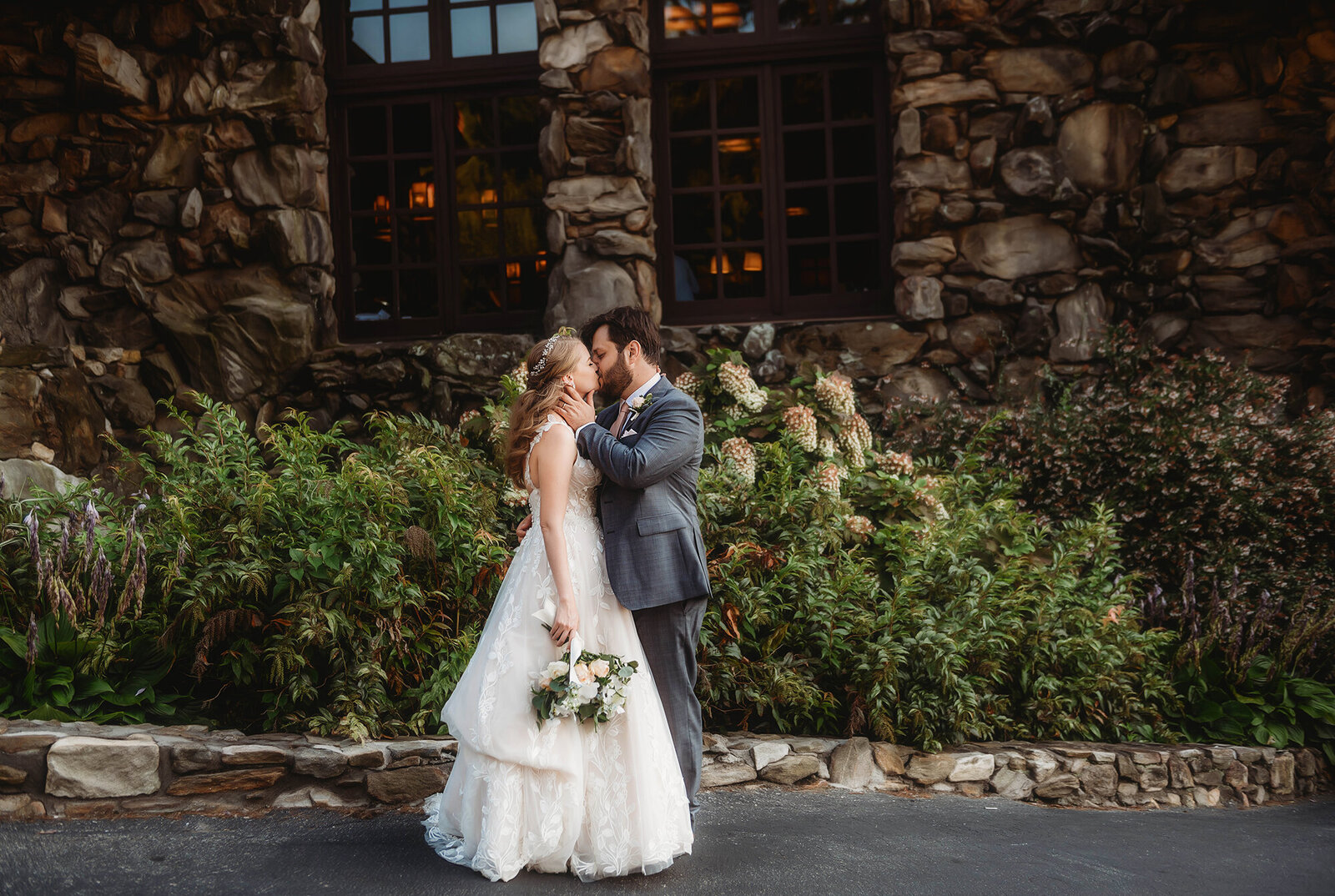 Bride and Groom embrace for Newlywed Portraits after their Micro Wedding Ceremony at Grove Park Inn in Asheville, NC.