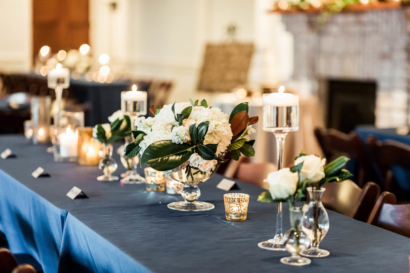 Beautiful floral centerpieces are on each table, Coleman Hall, Charleston Wedding Photography.