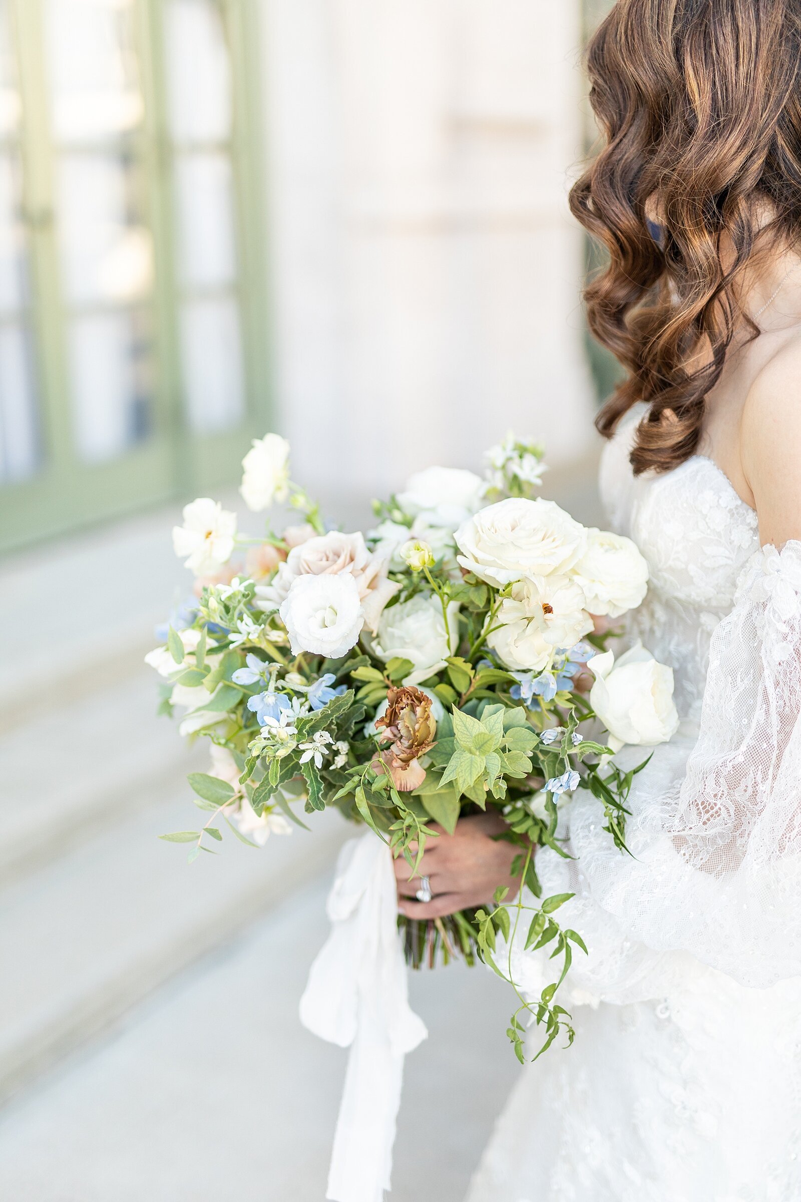 Bride holding wildflower bridal bouquet at The Ebell of Los Angeles.