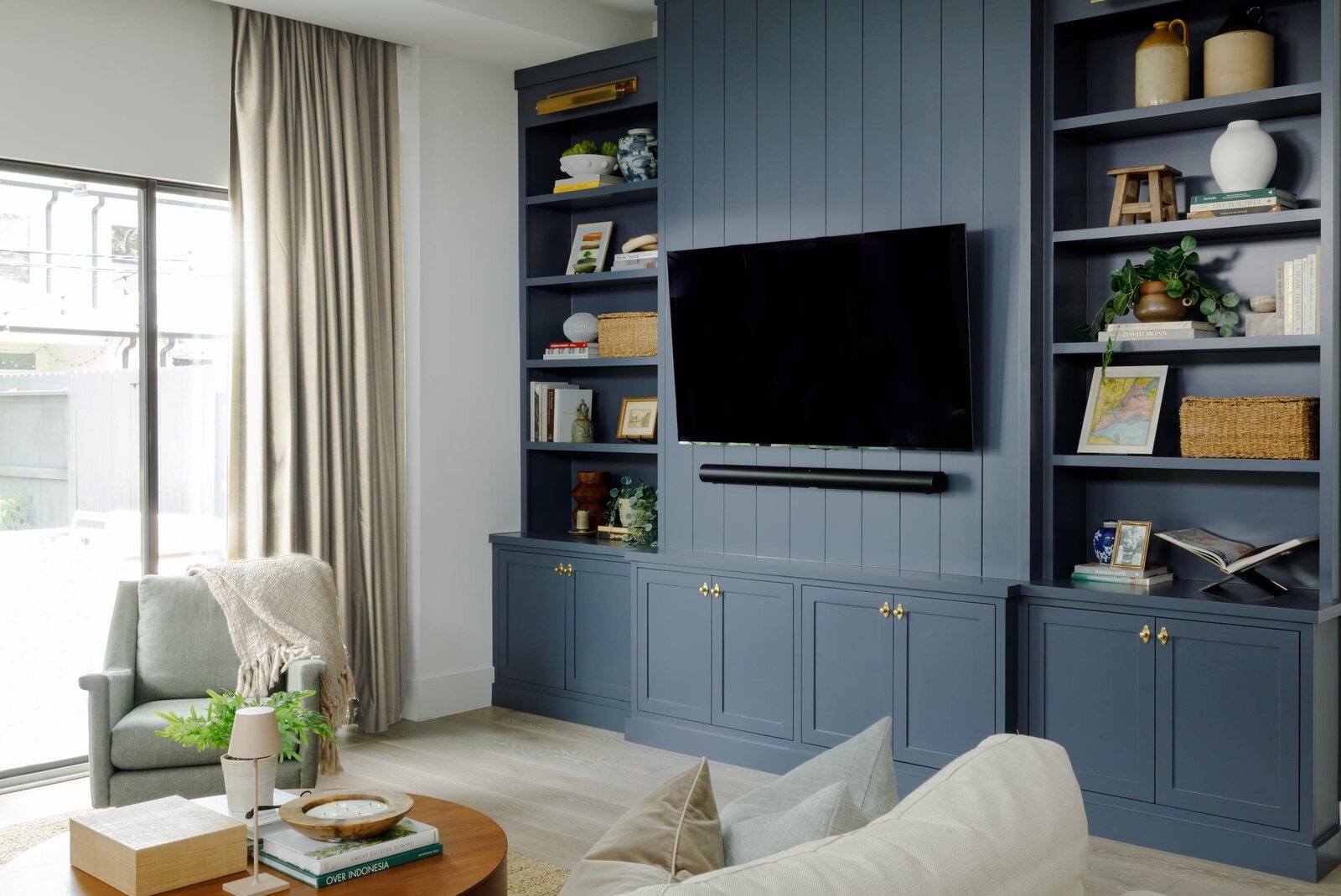 vision and hammer blue painted entertainment center in living room