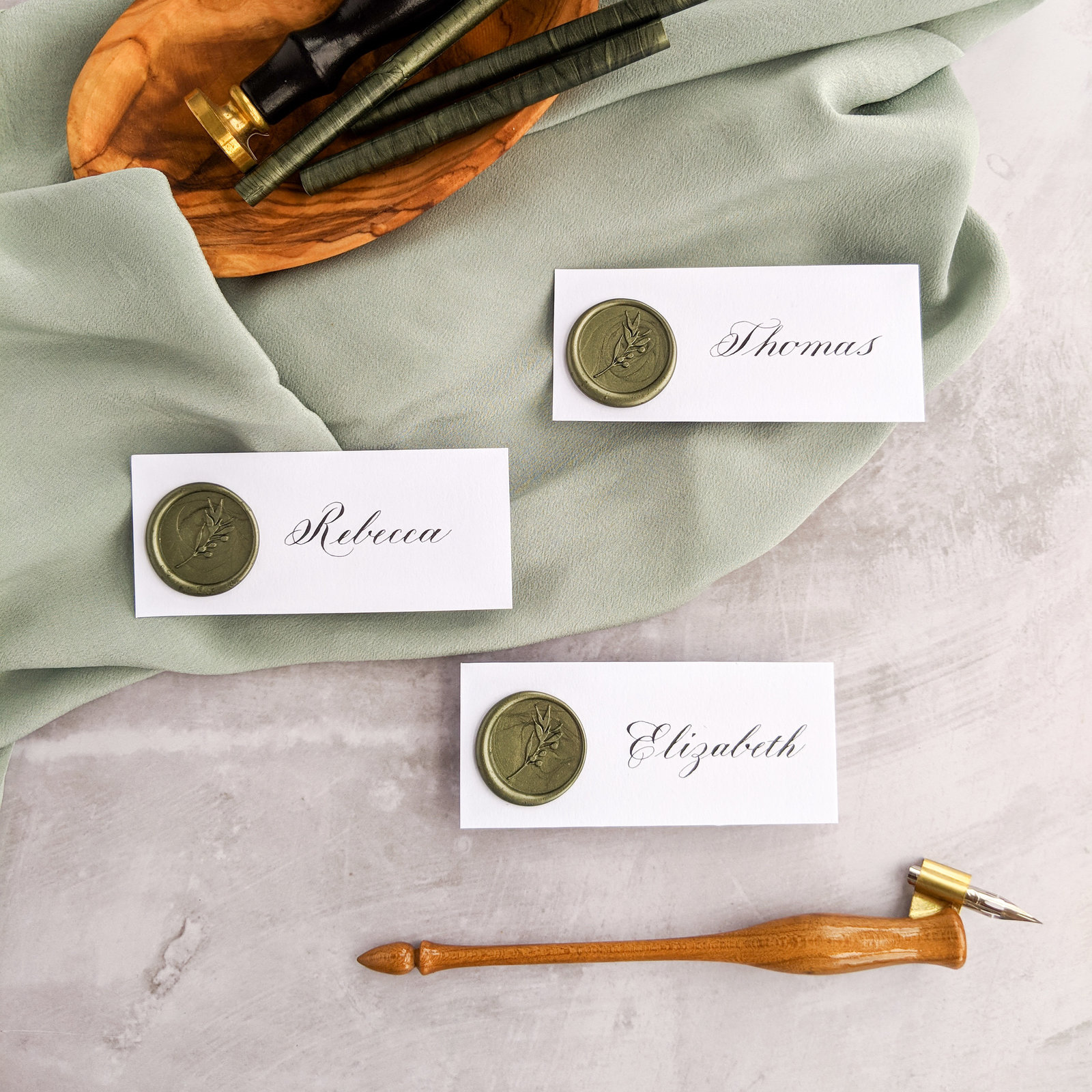 Copperplate calligraphy with olive green wax seal